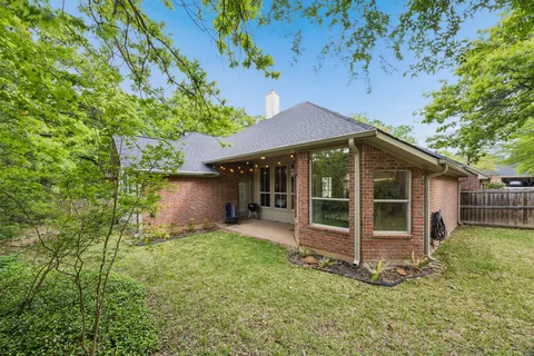 a house with trees in the background