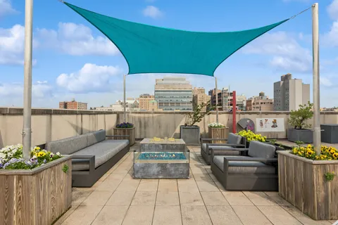a view of roof deck with seating space