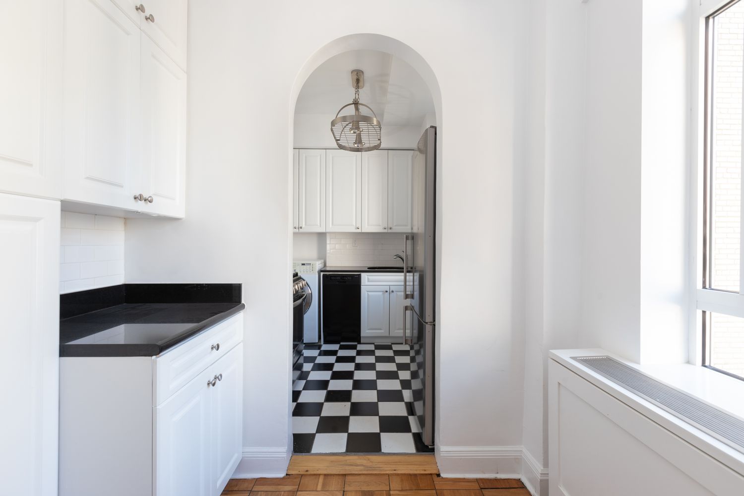 a kitchen with a refrigerator and a stove