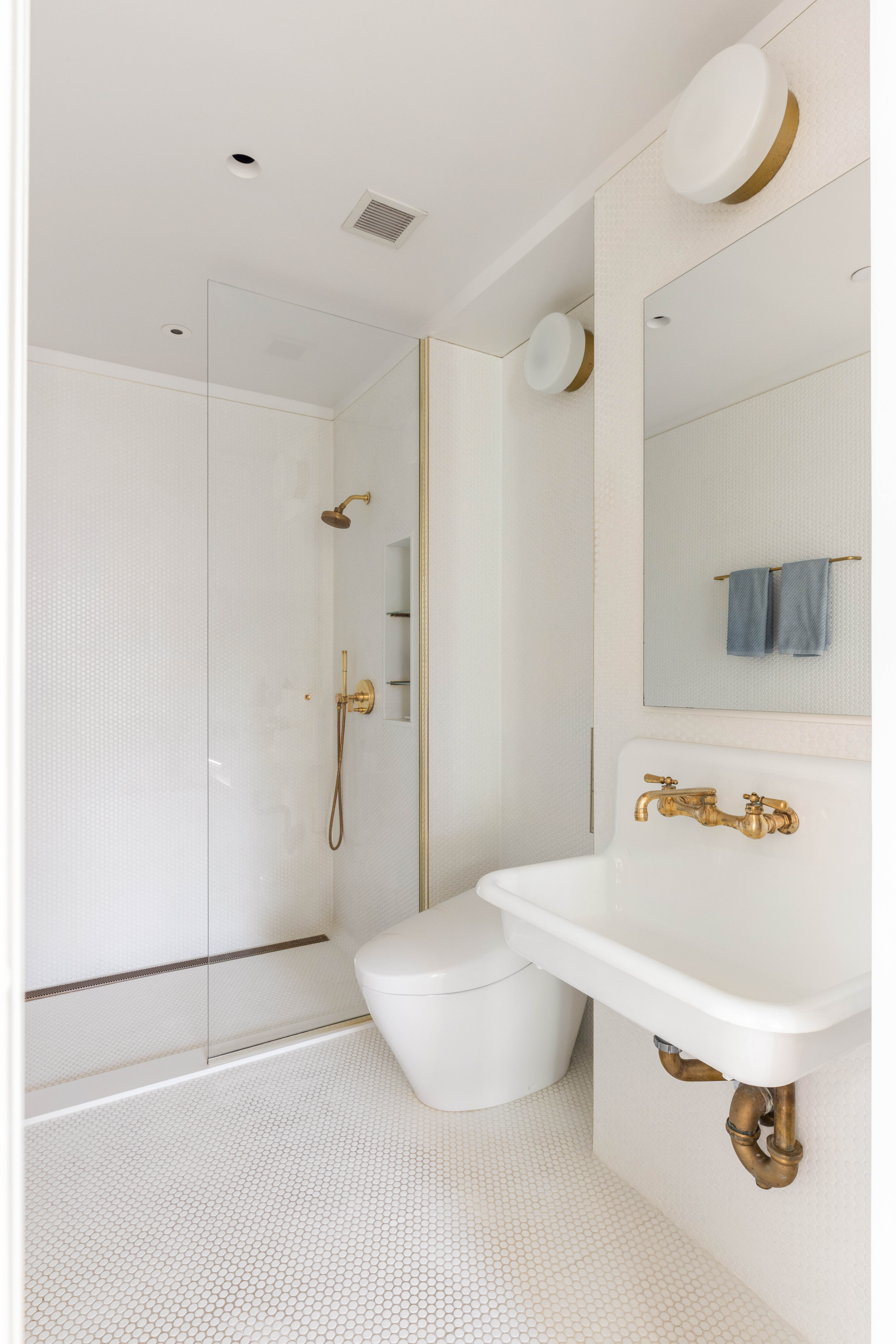 130 Jane Street, Unit 5/6F Manhattan, NY 10014 - Photo 19 of 23 a bathroom with a sink a toilet and shower