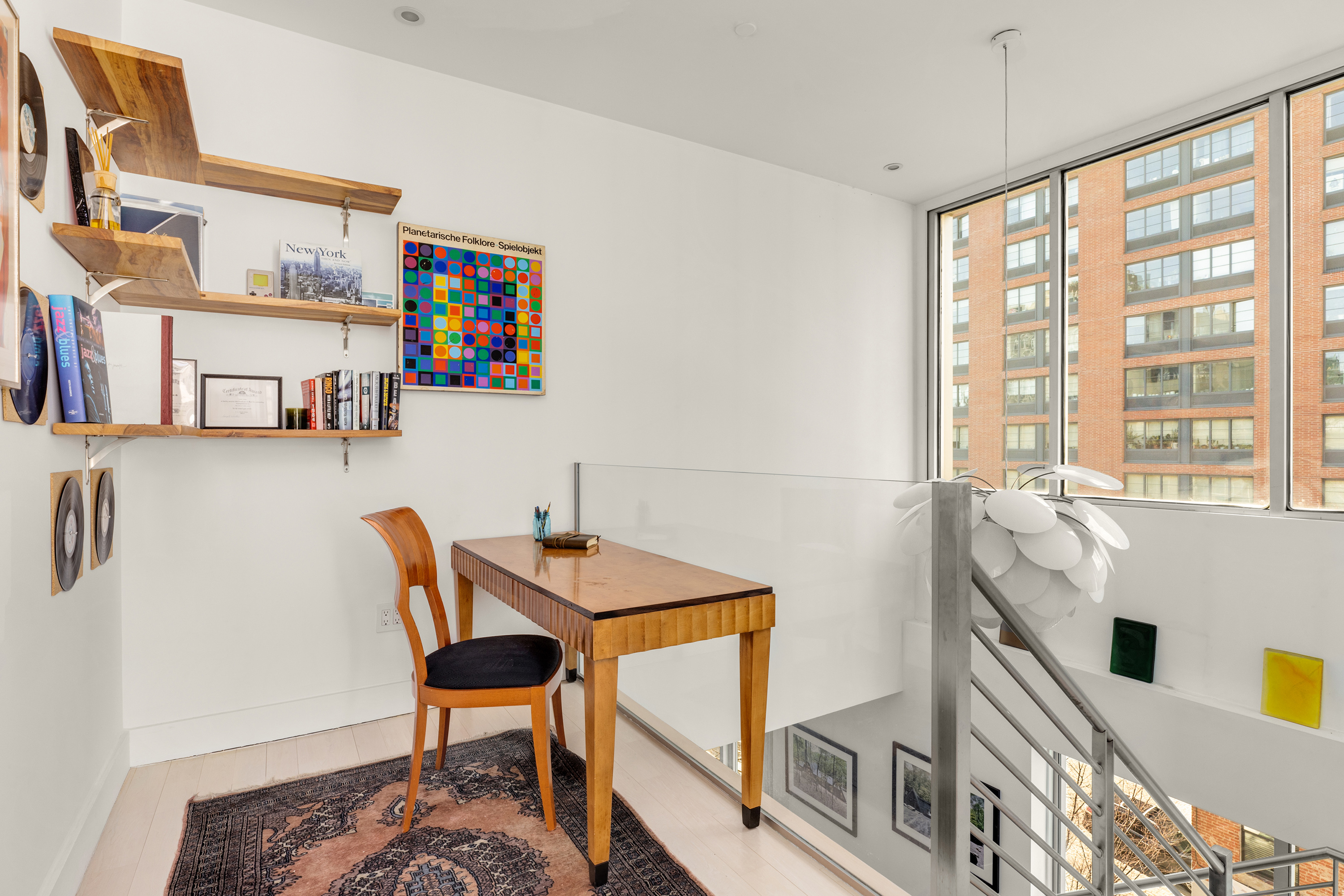 24 Dunham Place, Unit PHA Brooklyn, NY 11249 - Photo 12 of 19 a view of a workspace with furniture and a window