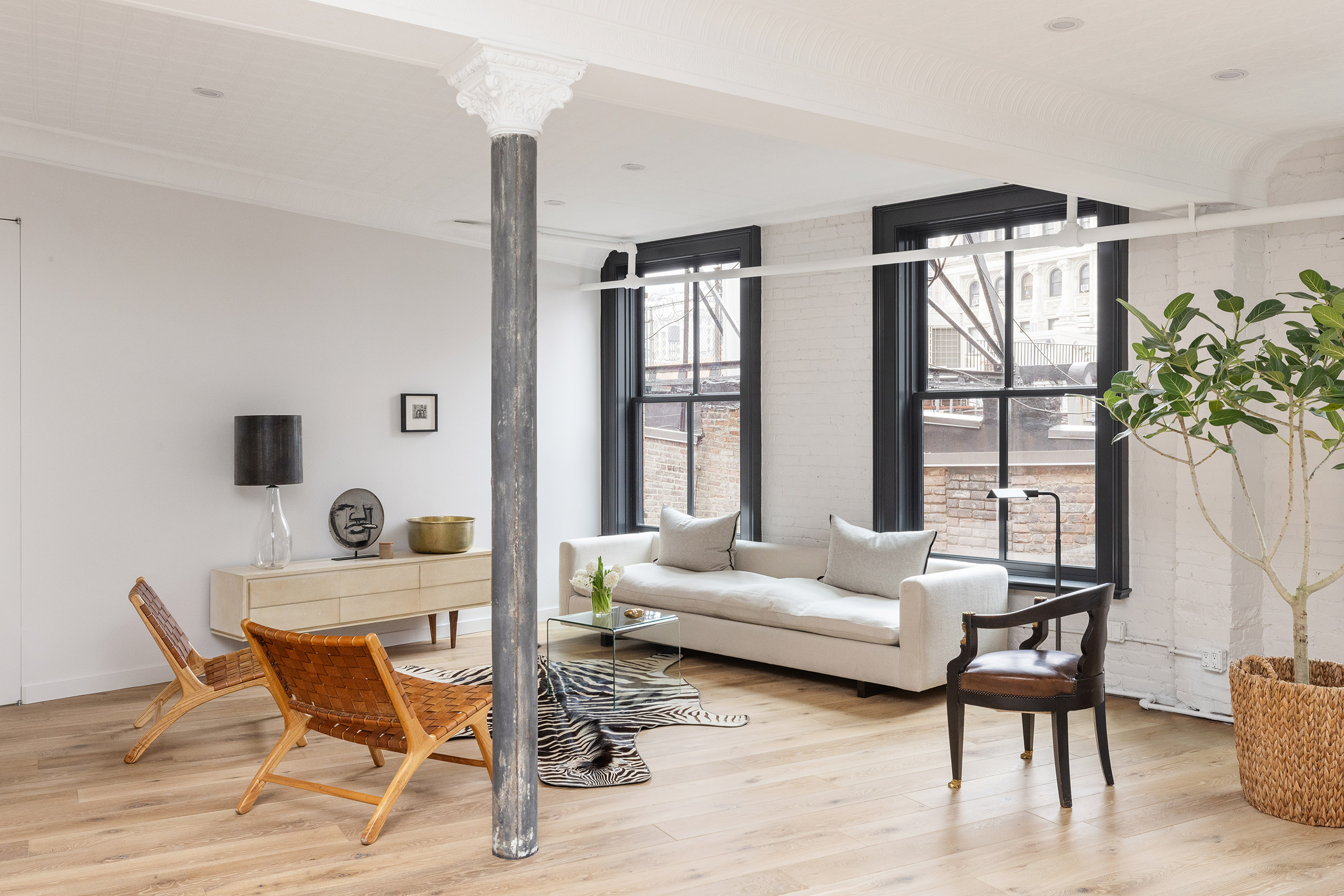 22 East 18th Street, Unit PH6B Manhattan, NY 10003 - Photo 2 of 13 a living room with furniture and a window