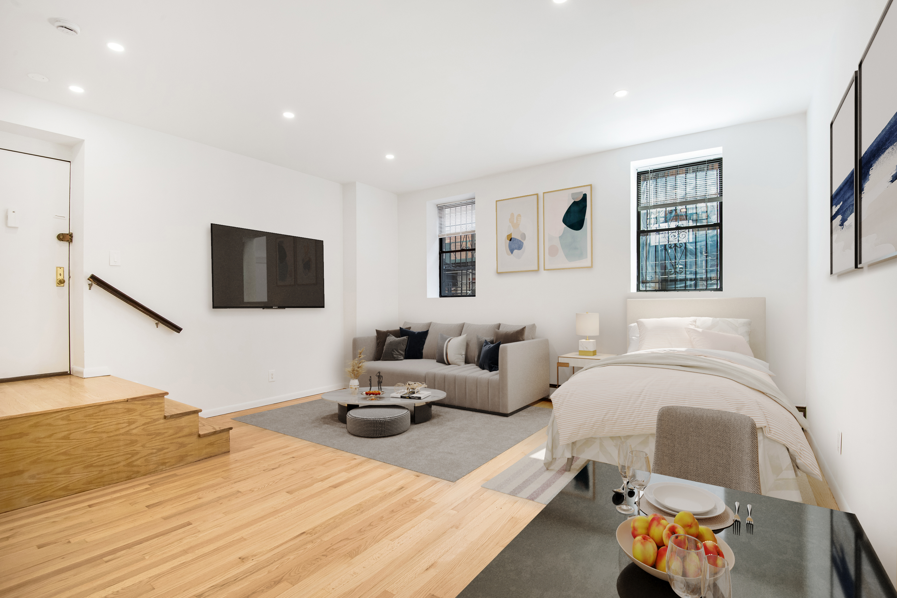 a bedroom with furniture and a flat screen tv