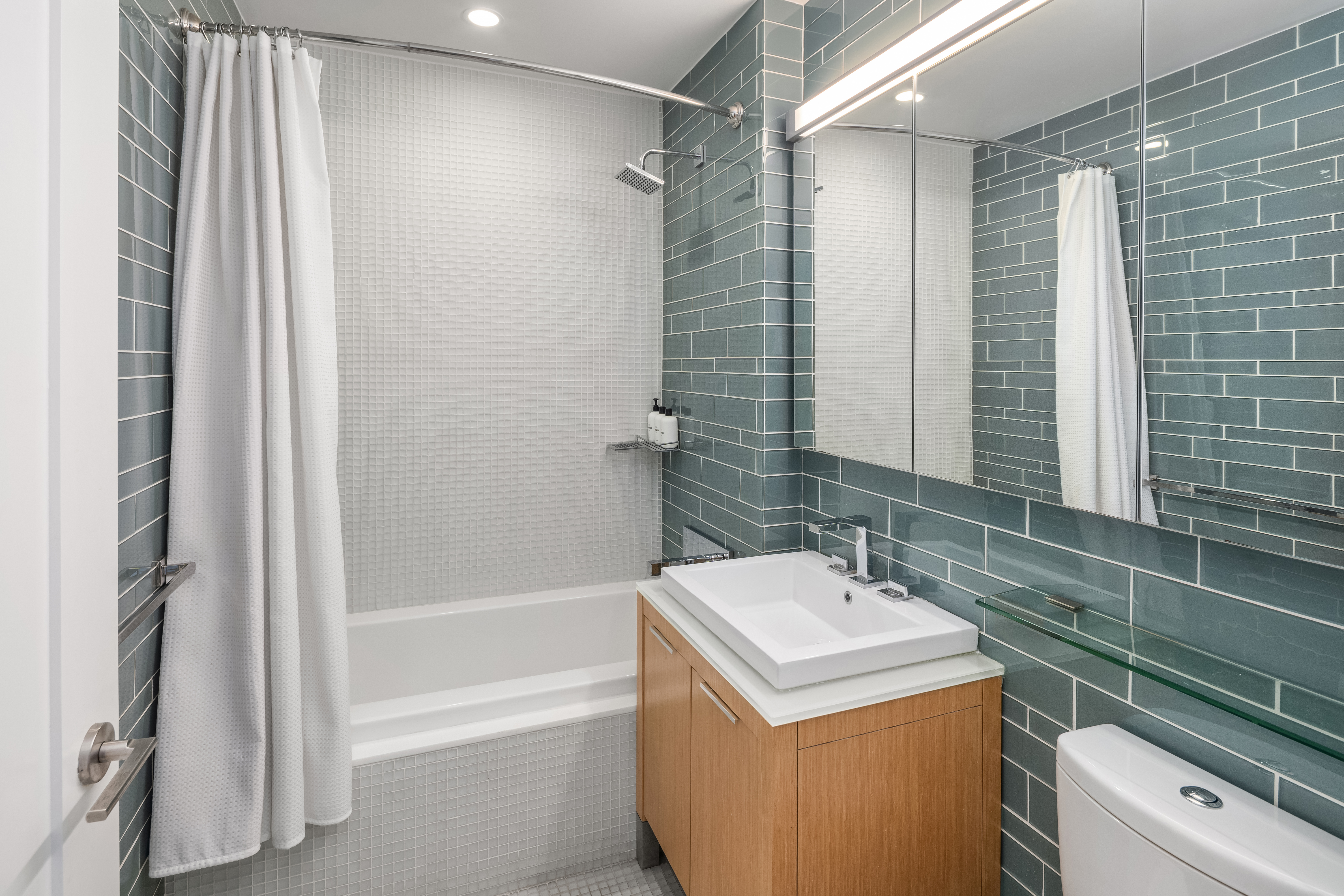 22 North 6th Street, Unit 4S Brooklyn, NY 11249 - Photo 8 of 12 a bathroom with a sink toilet and shower