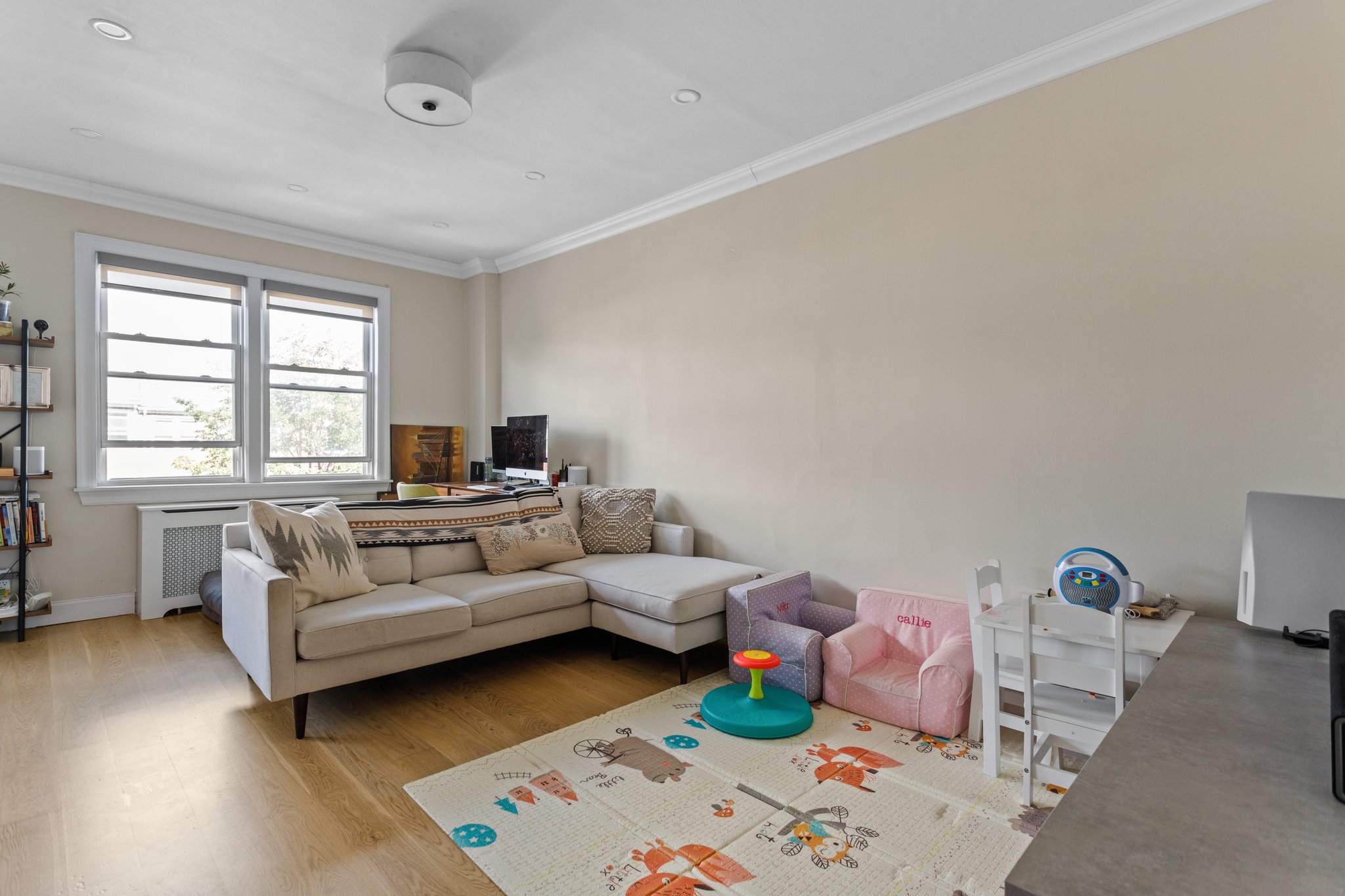 22-45 47th Street, Unit 3 Queens, NY 11105 - Photo 6 of 14 a living room with furniture and a window