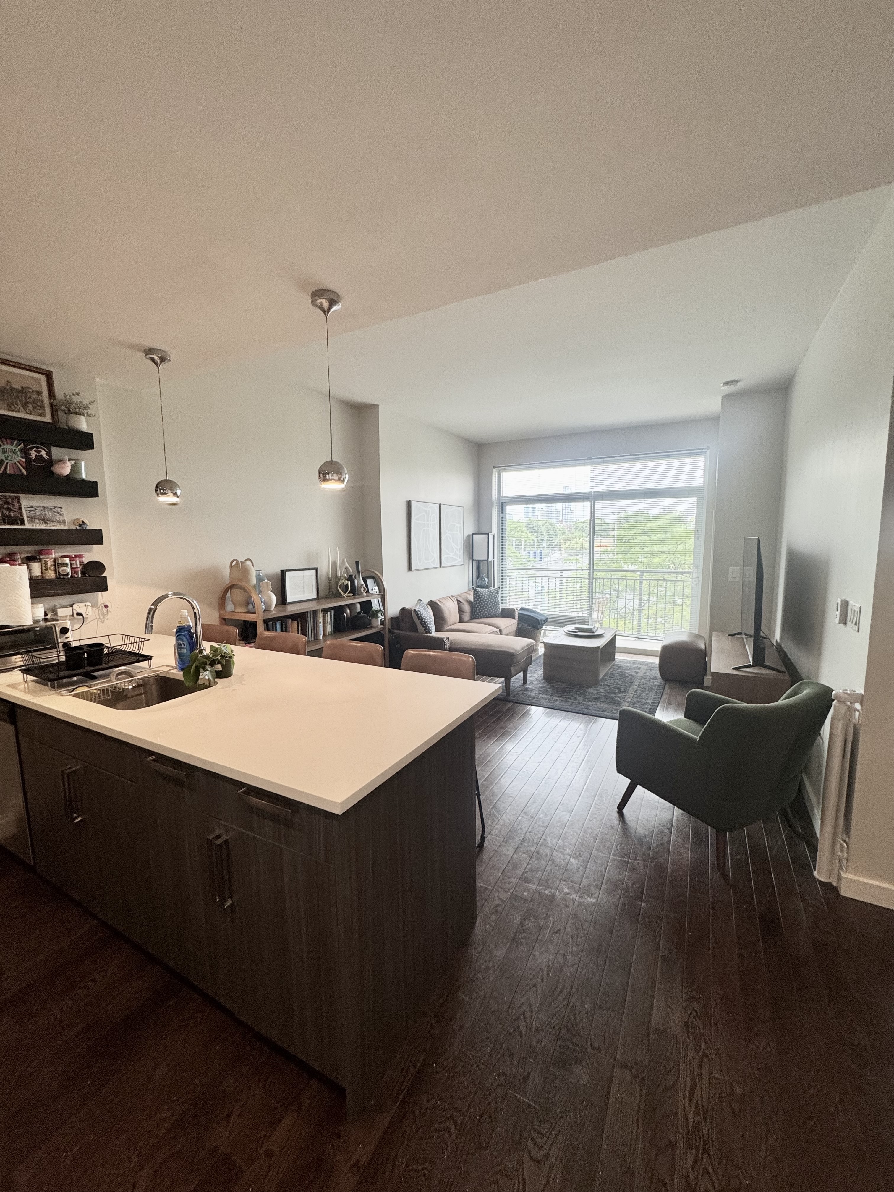 Broadway, Unit 306 Queens, NY 11106 - Photo 3 of 7 a open kitchen with sink cabinets and couches with wooden floor