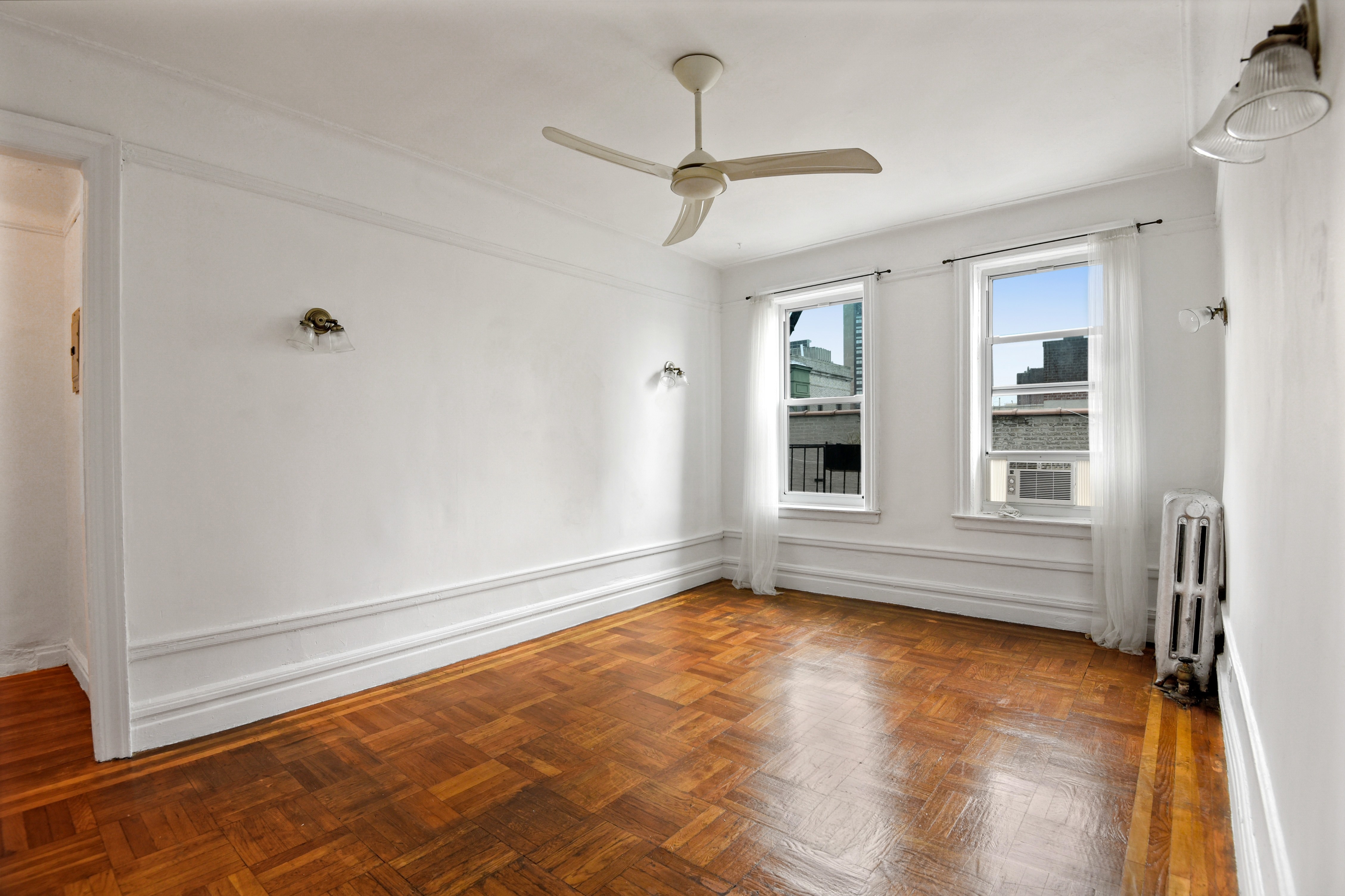 720 West 173rd Street, Unit 59 Manhattan, NY 10032 - Photo 2 of 11 a view of an empty room with a window