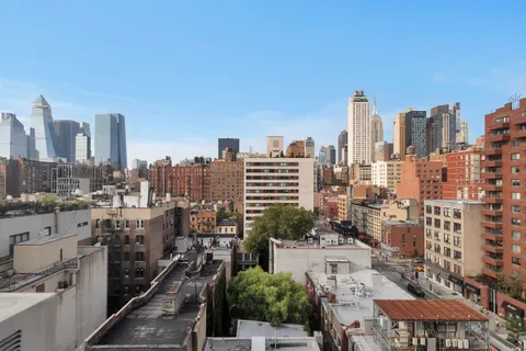 a view of city and a tall buildings