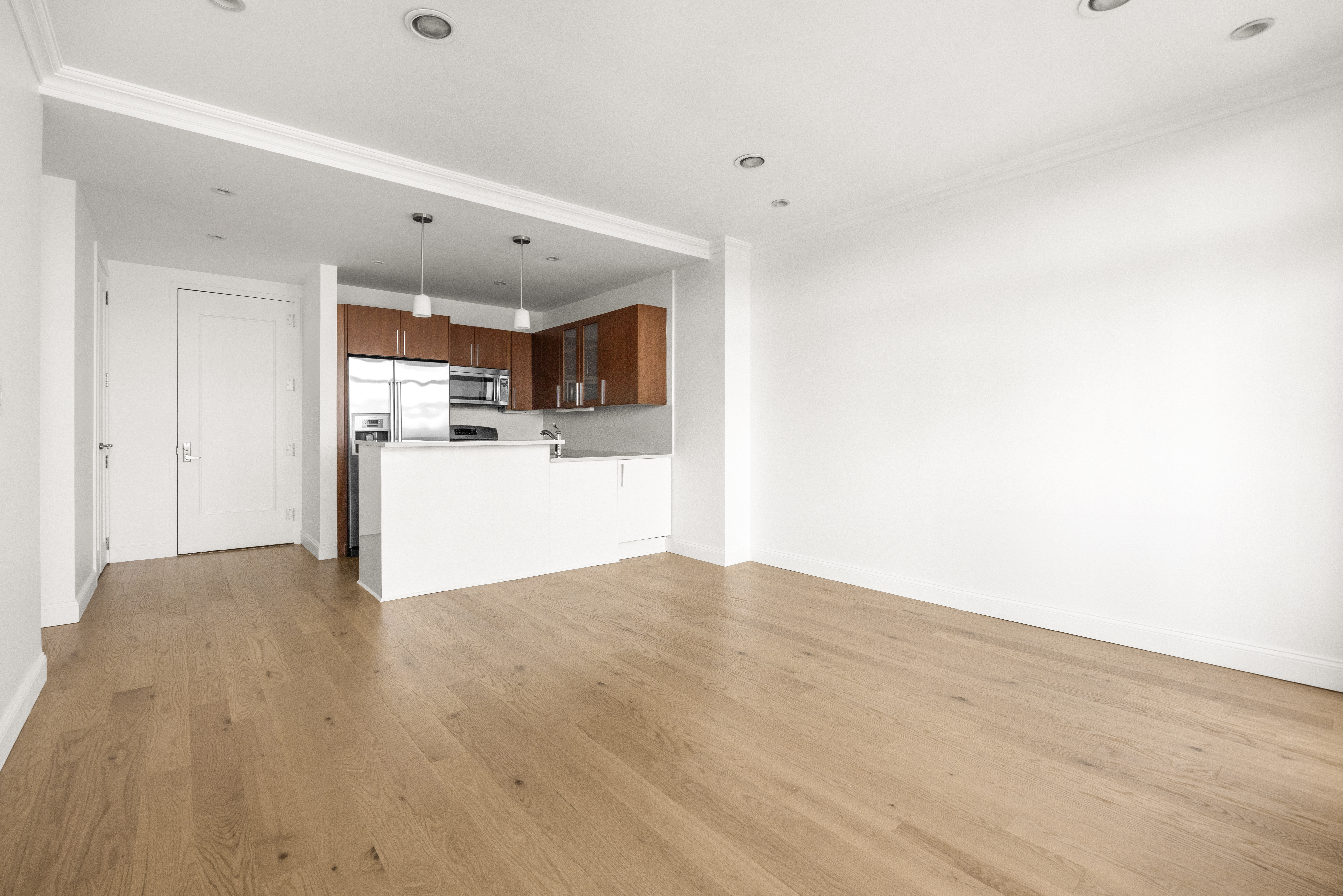 162 16th Street, Unit 7E Brooklyn, NY 11215 - Photo 4 of 23 a view of a kitchen with a sink and a refrigerator