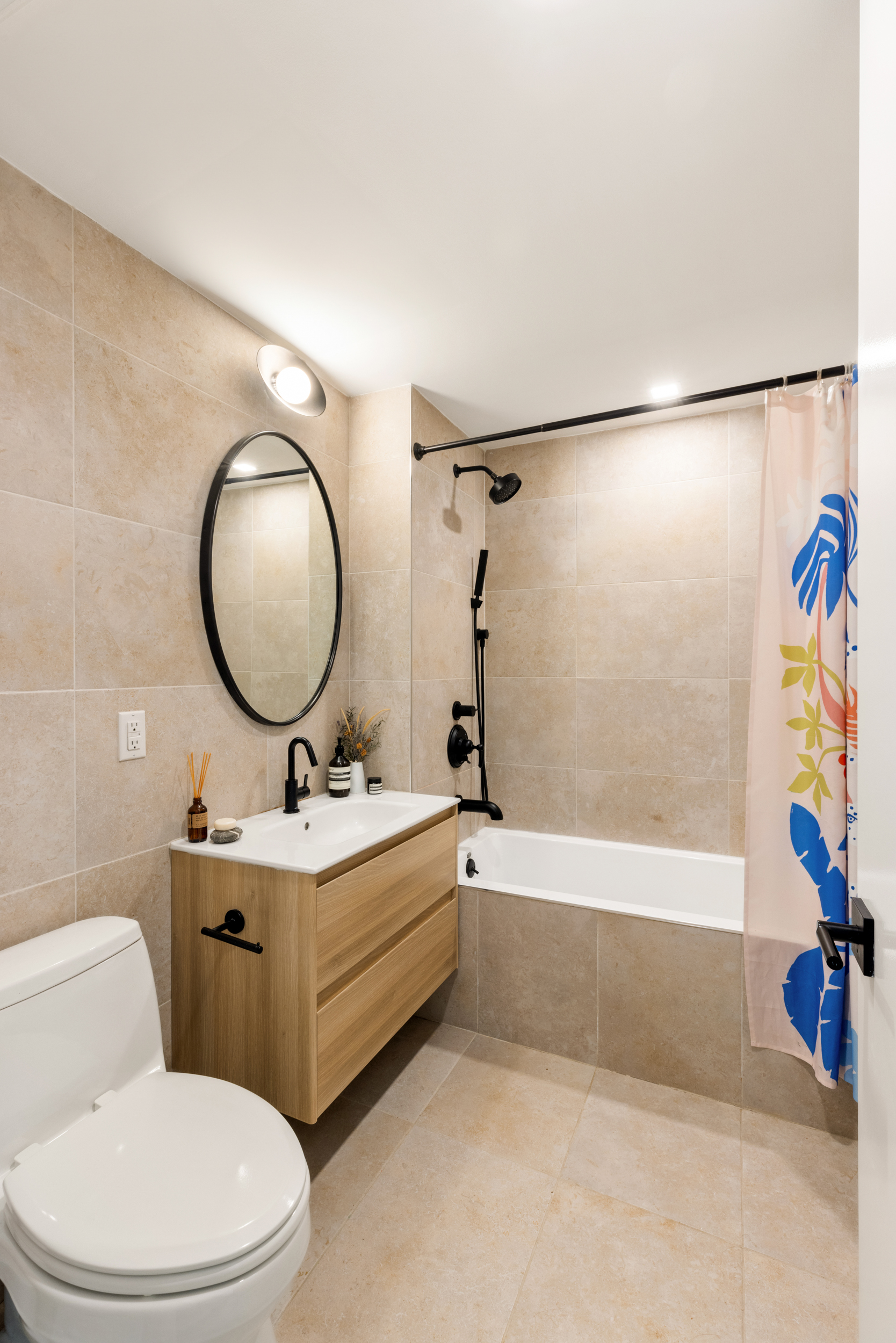 205 Freeman Street, Unit 3 Brooklyn, NY 11222 - Photo 7 of 9 a bathroom with a toilet a sink and a mirror