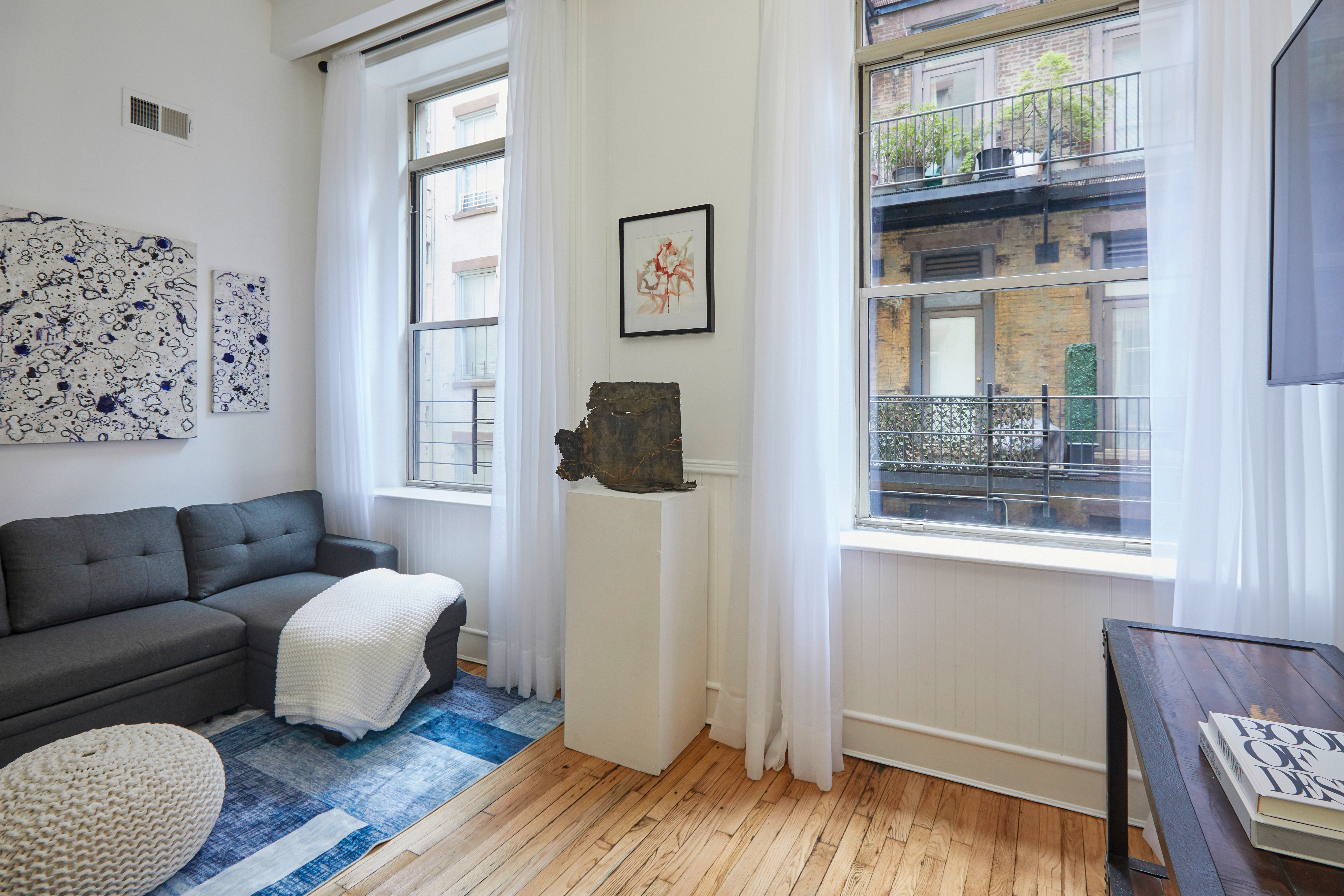 80 Leonard Street, Unit 3G Manhattan, NY 10013 - Photo 11 of 30 a living room with furniture and a window