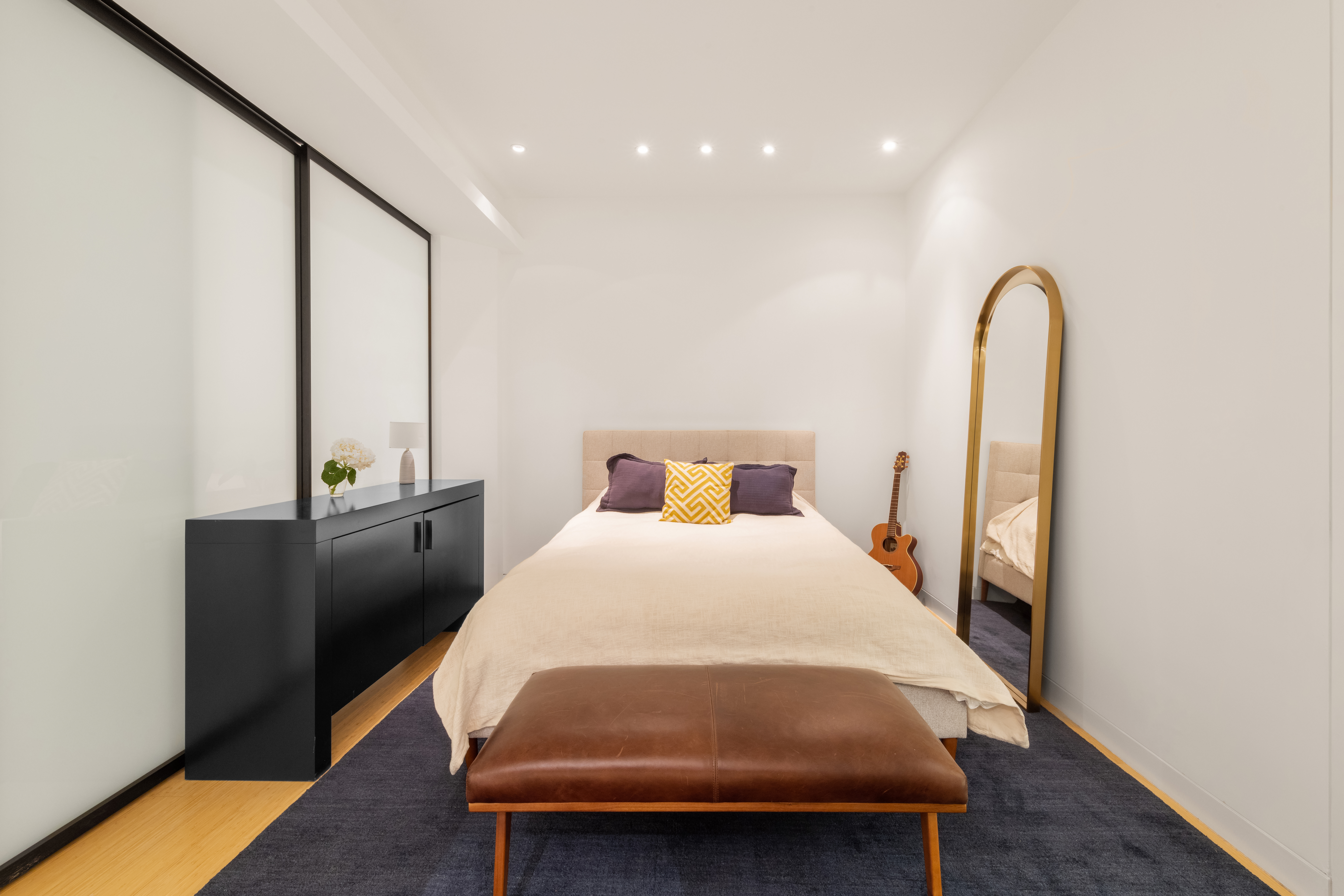 70 Washington Street, Unit 2K Brooklyn, NY 11201 - Photo 13 of 18 a bedroom with a bed and wooden floor