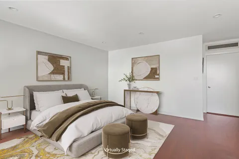 a bed room with a bed and a couch