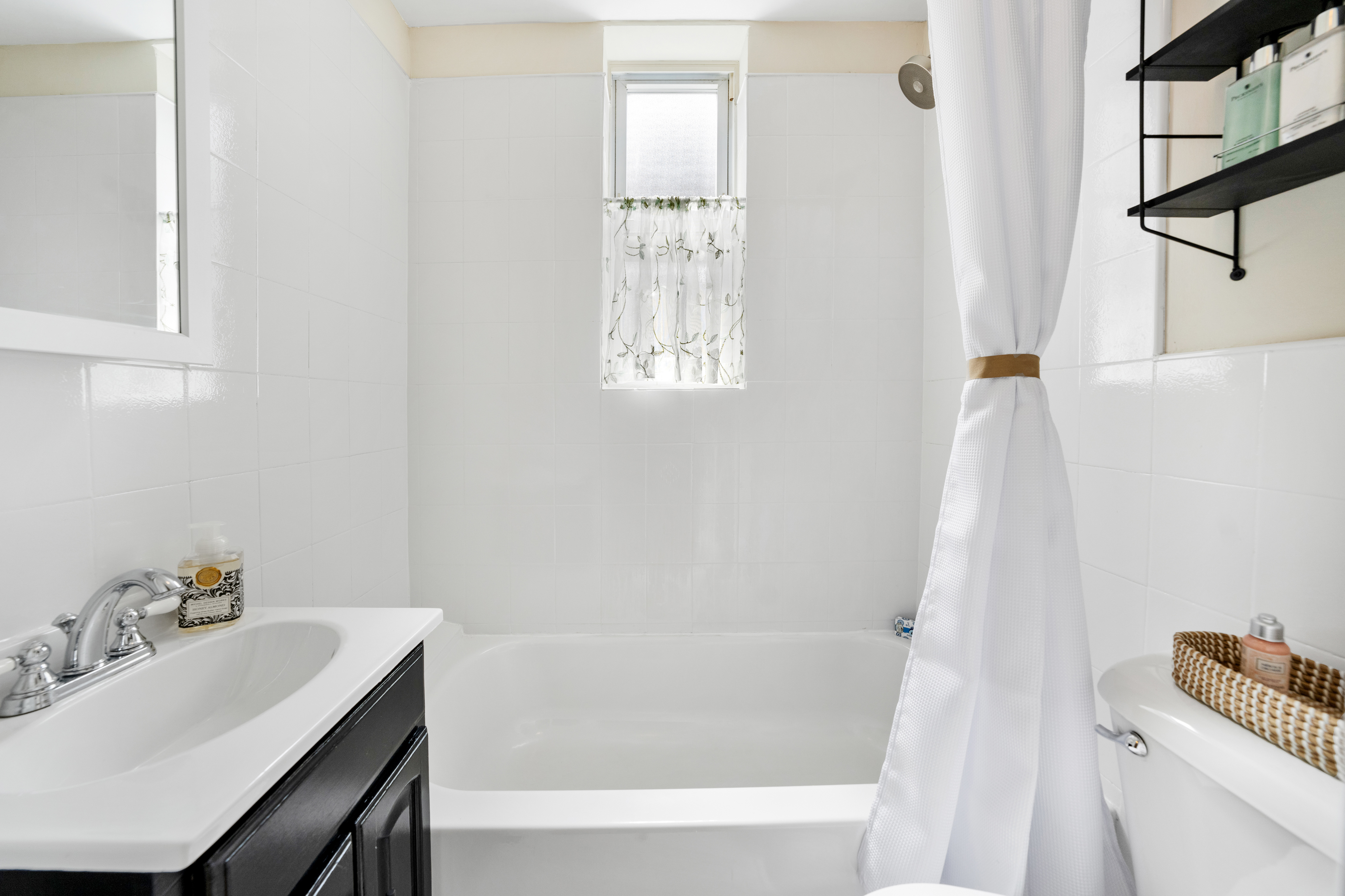 1286 Halsey Street, Unit 3B Brooklyn, NY 11237 - Photo 6 of 10 a bathroom with a sink and a bathtub