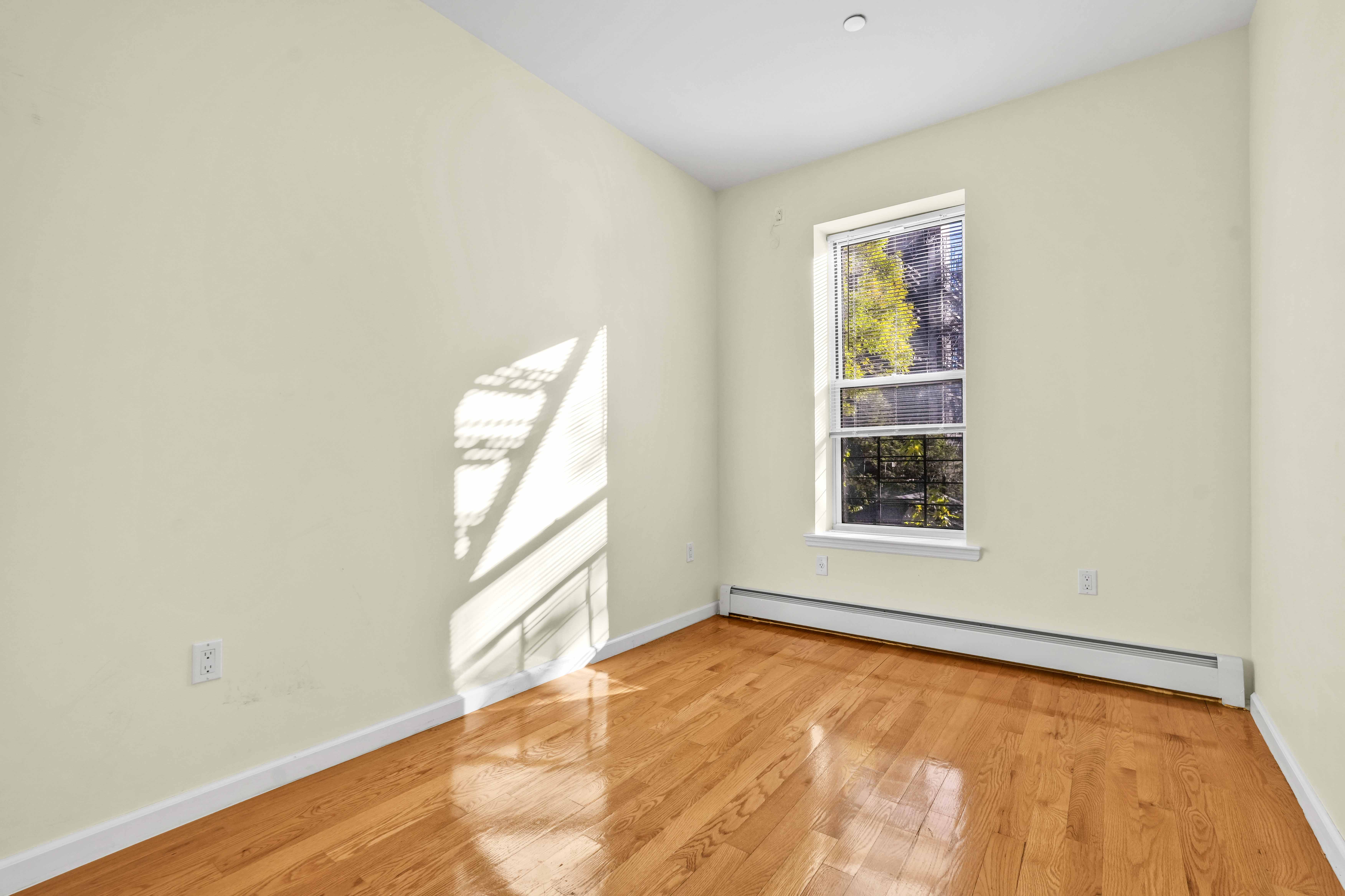 1892 Bergen Street, Unit 2 Brooklyn, NY 11233 - Photo 4 of 24 an empty room with windows