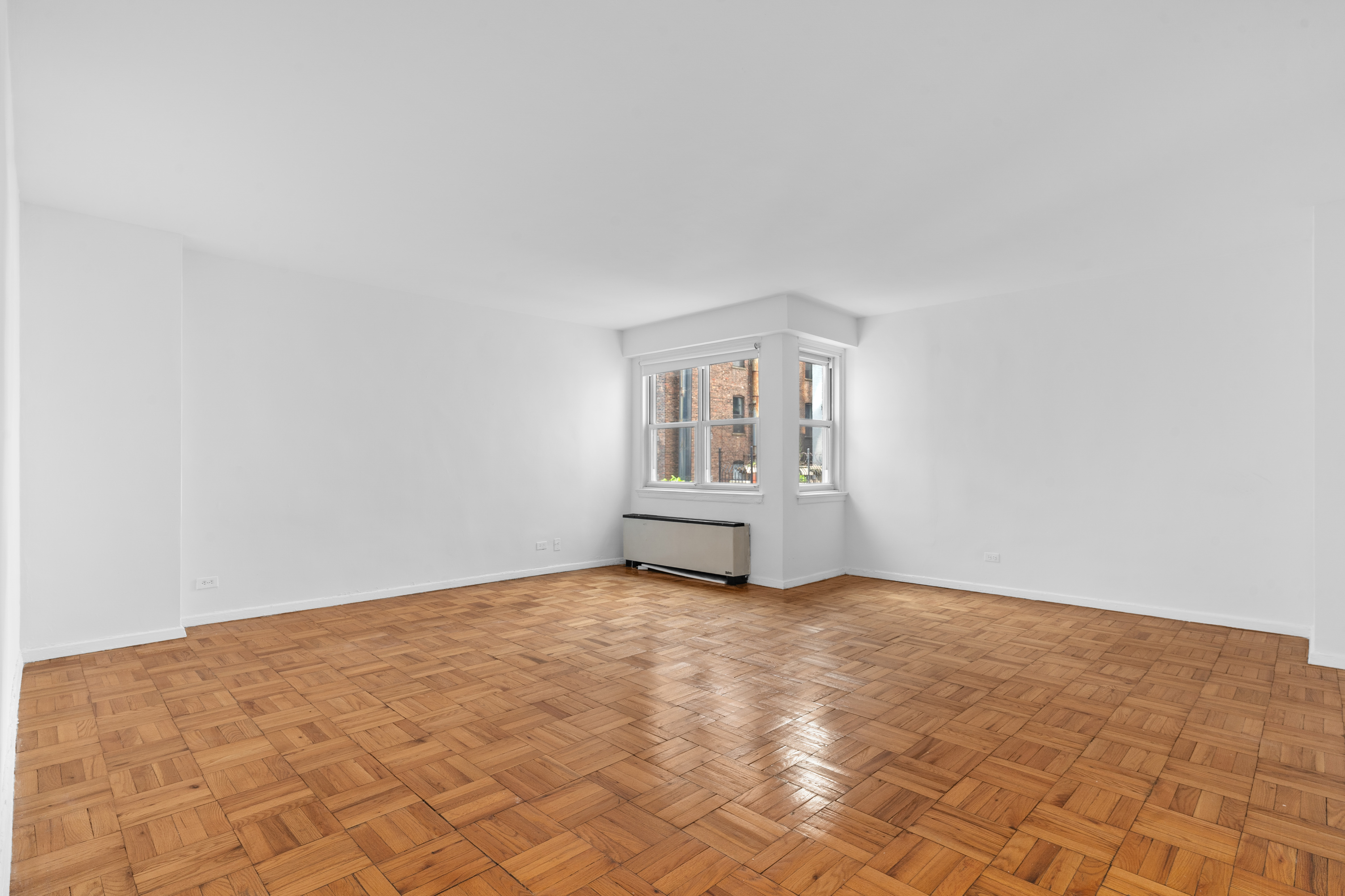 101 West 12th Street, Unit 3Z Manhattan, NY 10011 - Photo 2 of 7 an empty room with windows