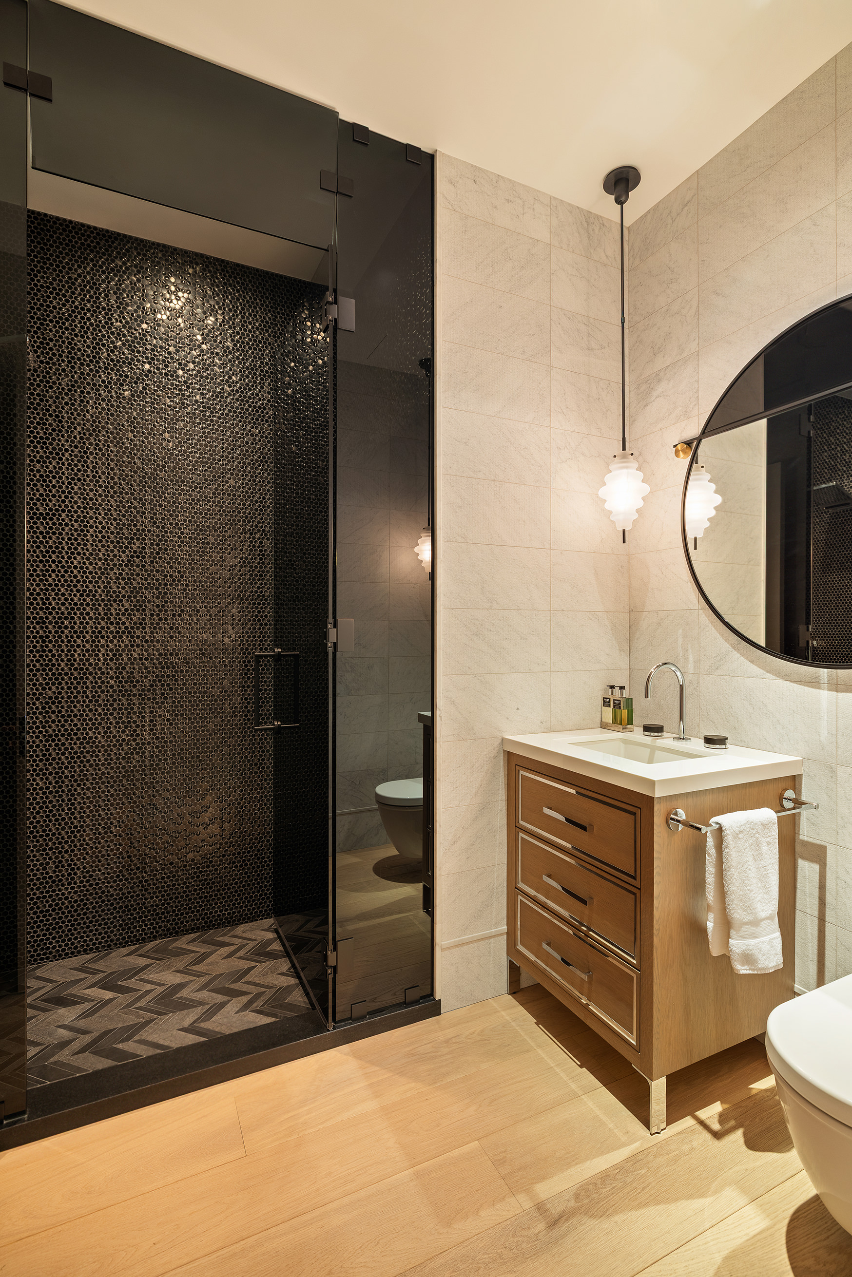 53 Greene Street, Unit 3 Manhattan, NY 10013 - Photo 20 of 22 a bathroom with a sink and mirror