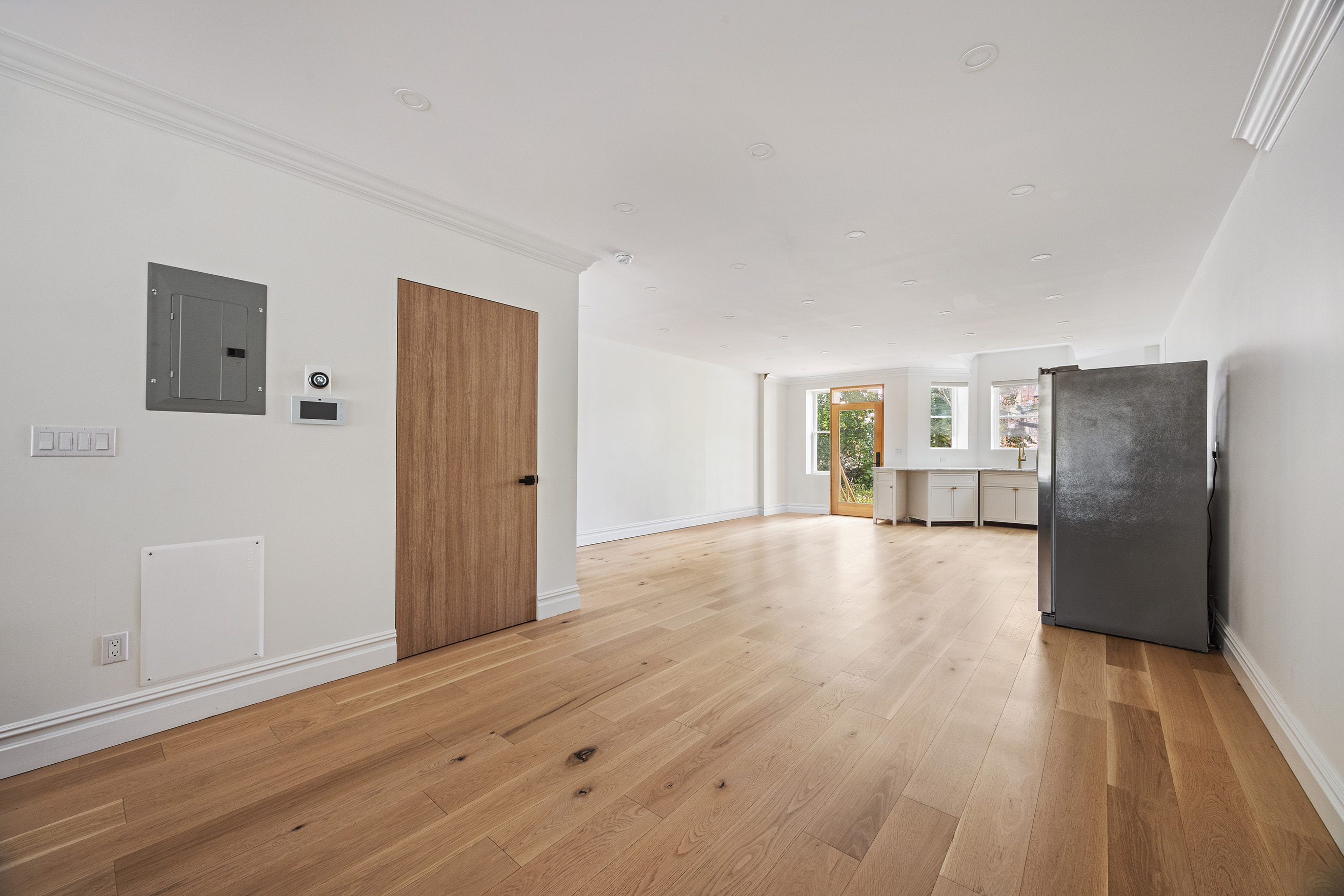 1423 Park Place Brooklyn, NY 11213 - Photo 6 of 17 a view of empty room with wooden floor