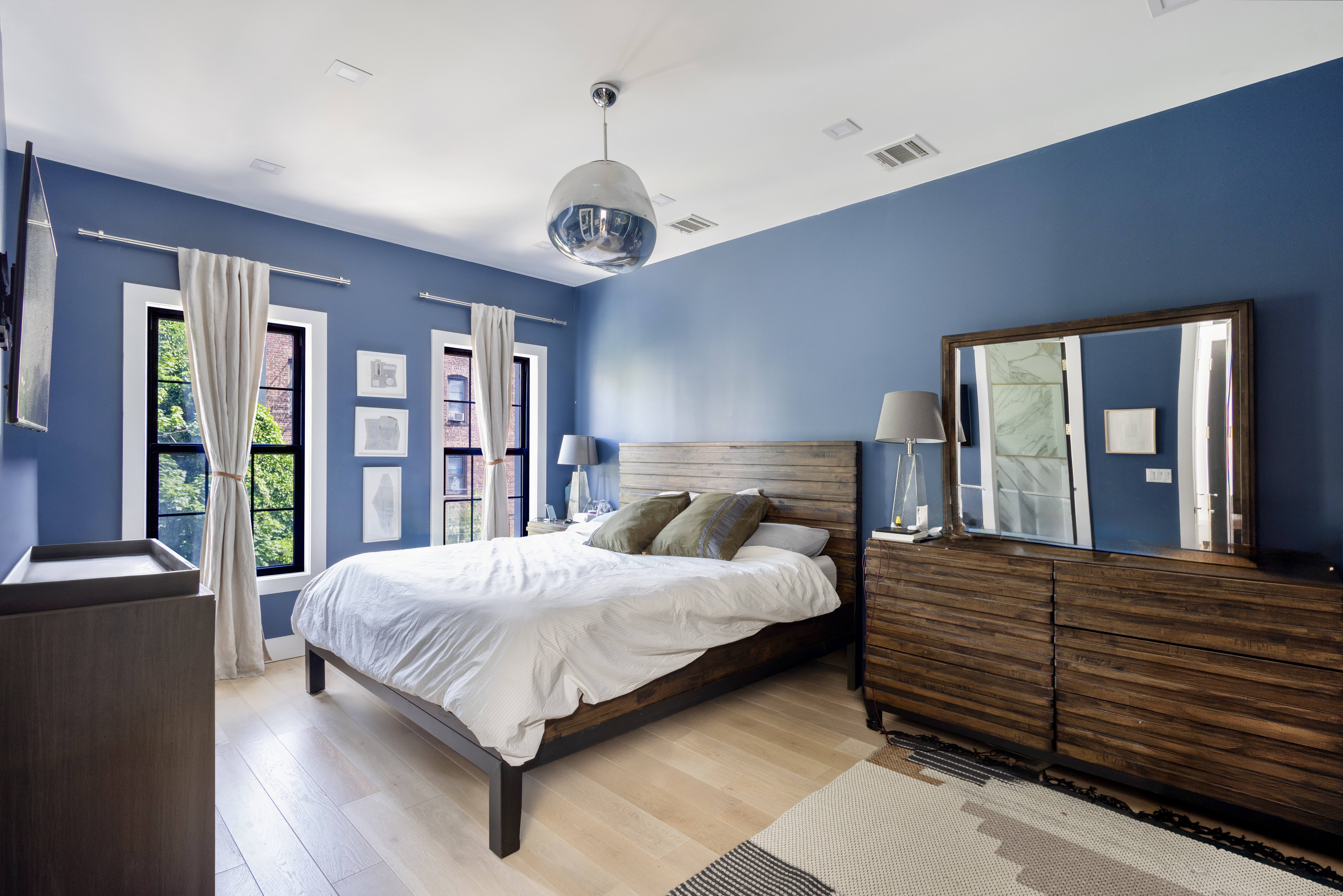 239 Winthrop Street Brooklyn, NY 11225 - Photo 13 of 20 a bedroom with a large bed and a large dresser