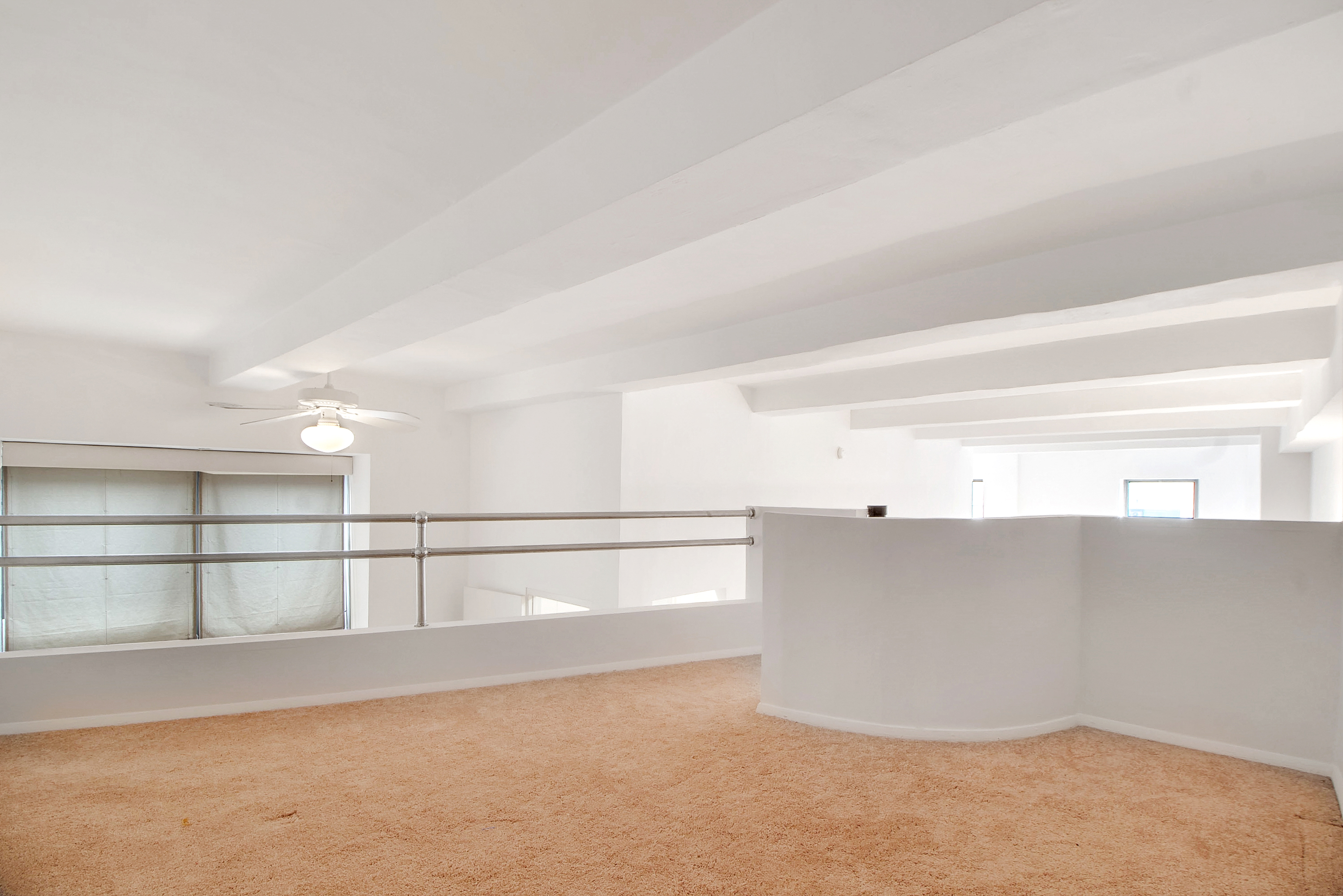 1255 5th Avenue, Unit 5J Manhattan, NY 10029 - Photo 8 of 17 a view of an empty room with a window