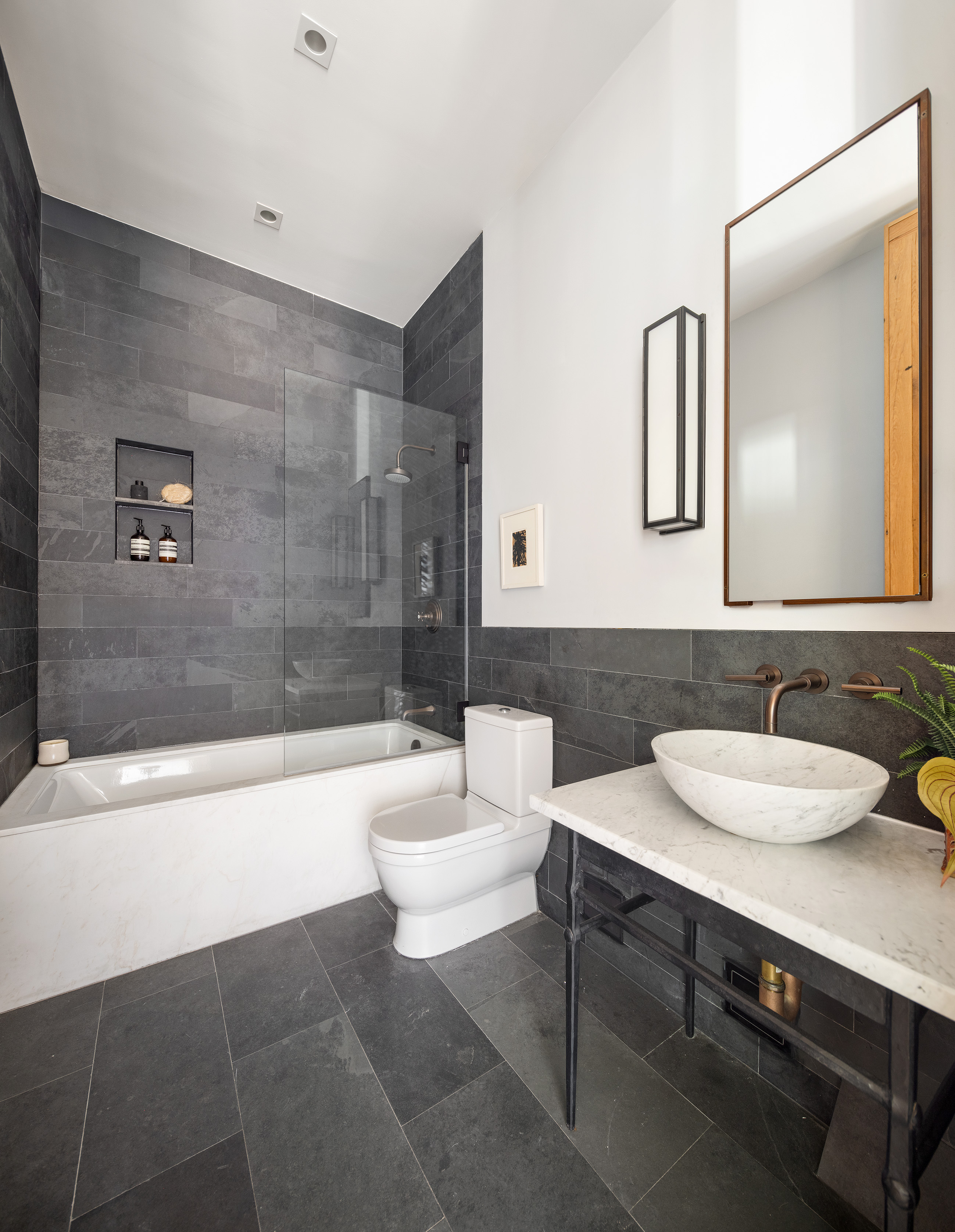 250 Mercer Street, Unit B706B707 Manhattan, NY 10012 - Photo 17 of 25 a bathroom with a sink a toilet and a bathtub