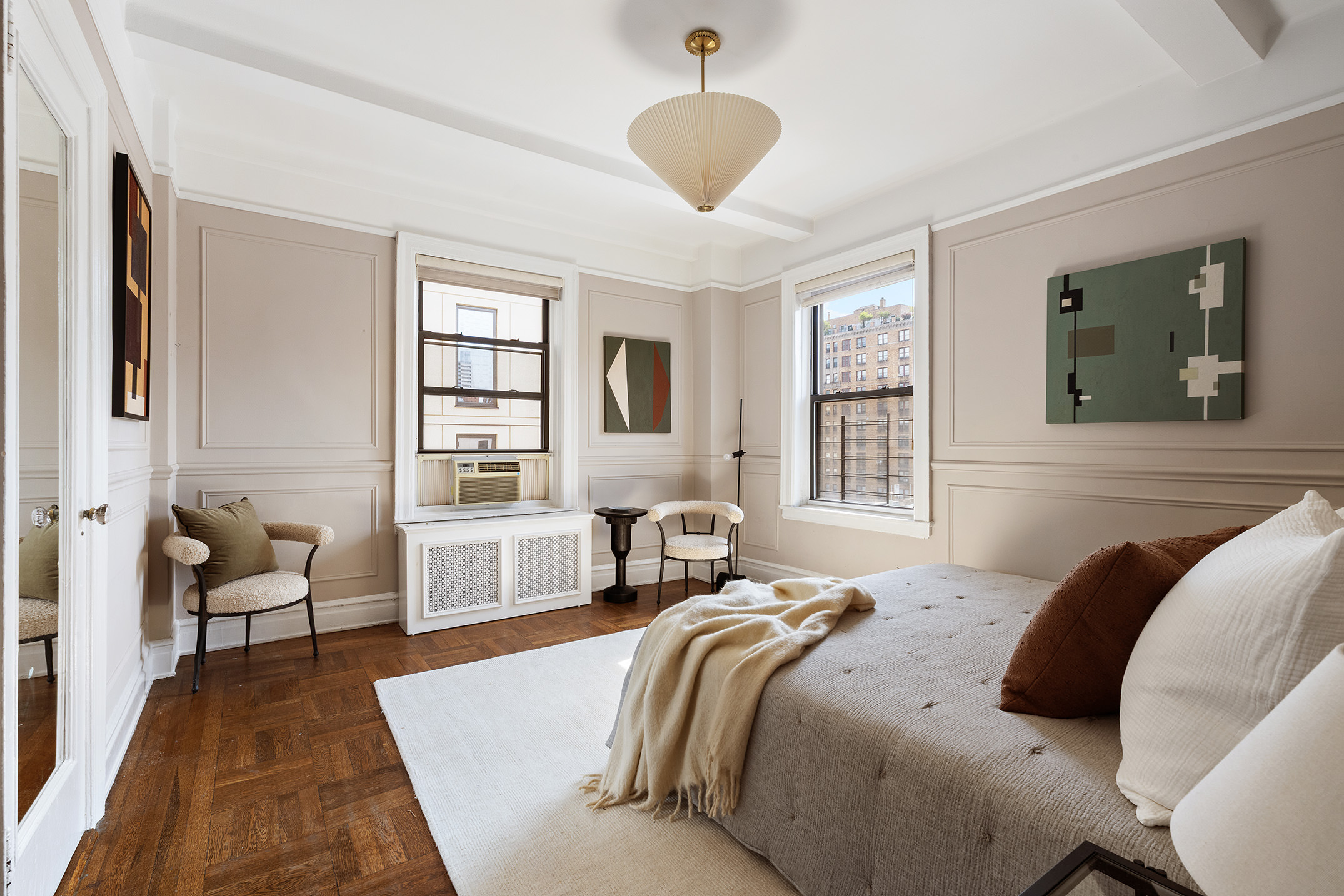 215 West 92nd Street, Unit 10F Manhattan, NY 10025 - Photo 6 of 11 a bedroom with a bed and wooden floor