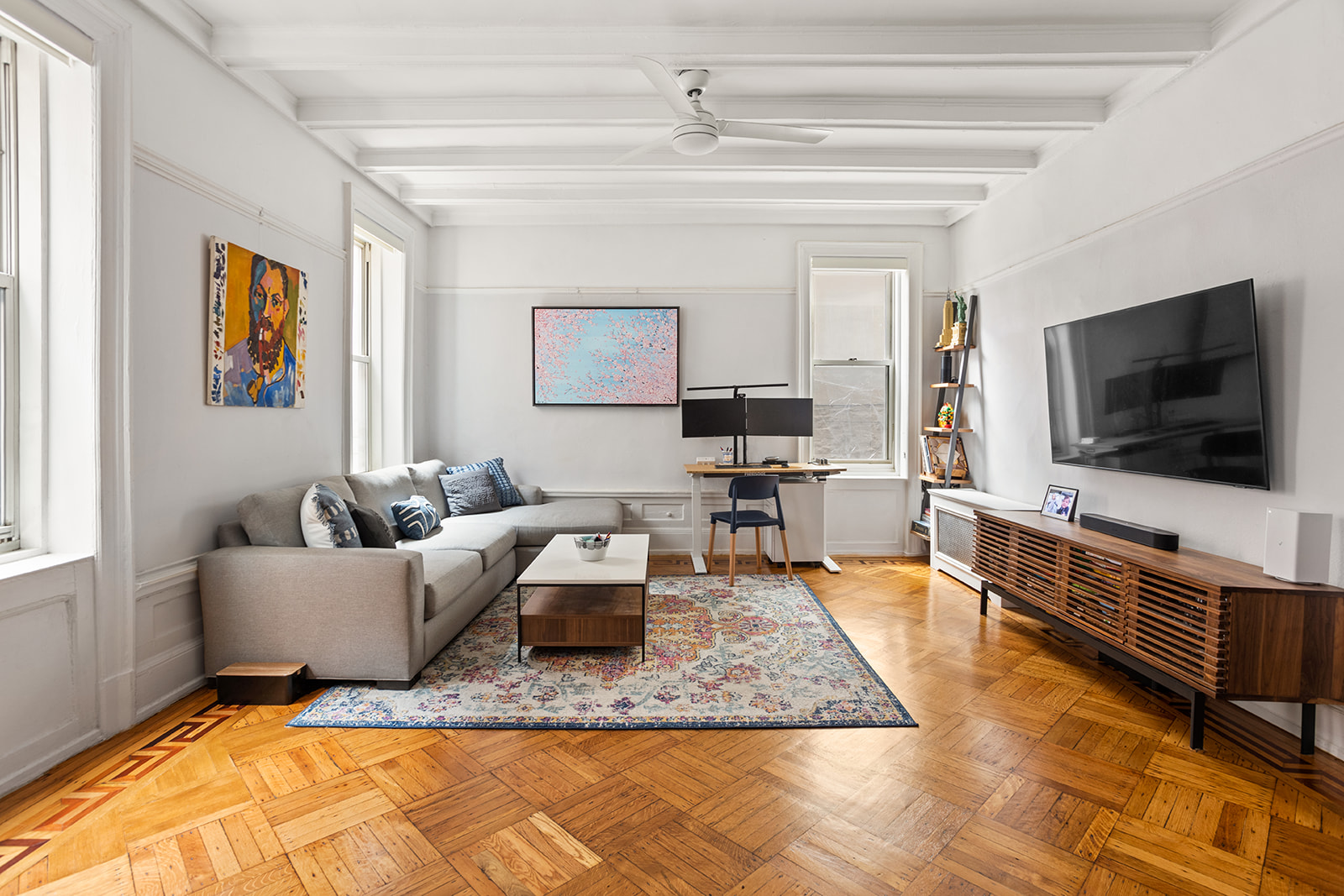 129 Columbia Heights, Unit 3 Brooklyn, NY 11201 - Photo 2 of 7 a living room with furniture and a flat screen tv
