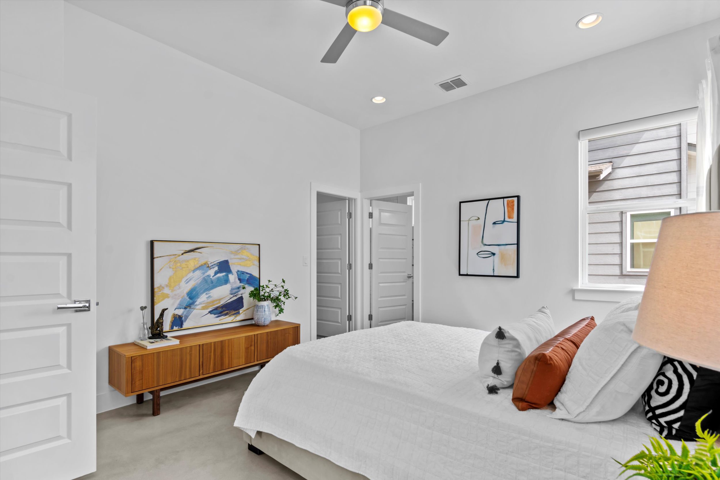 513 West Croslin Street, Unit A Austin, TX 78752 - Photo 15 of 39 a bedroom with a bed and lamp