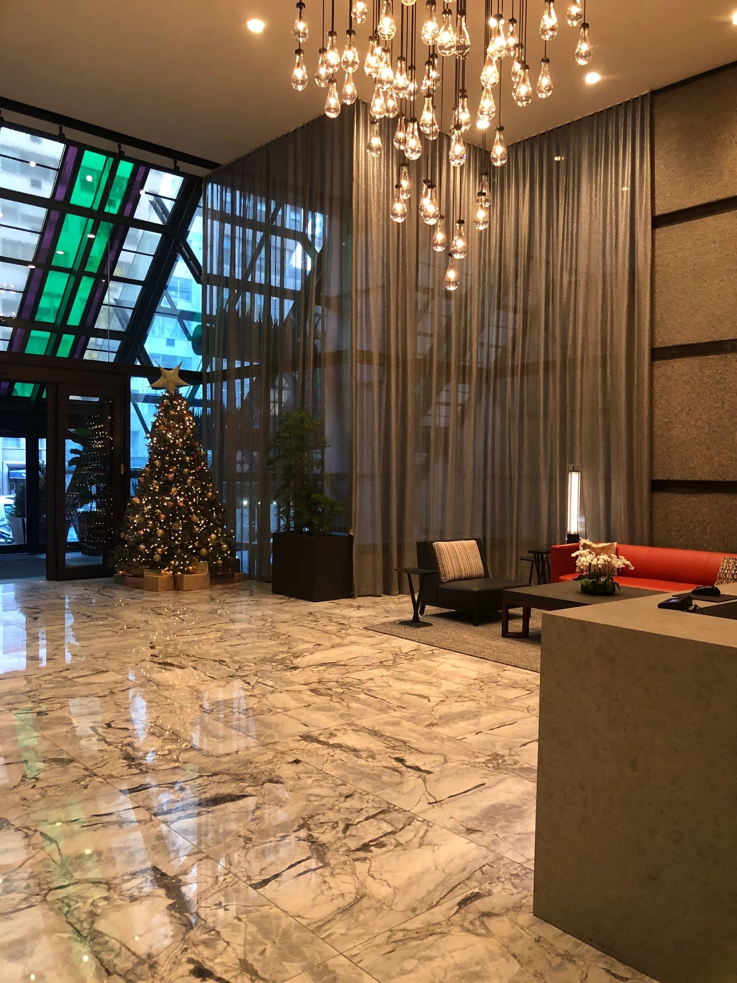 117 East 57th Street, Unit 21H Manhattan, NY 10022 - Photo 15 of 25 a view of a lobby with a yard