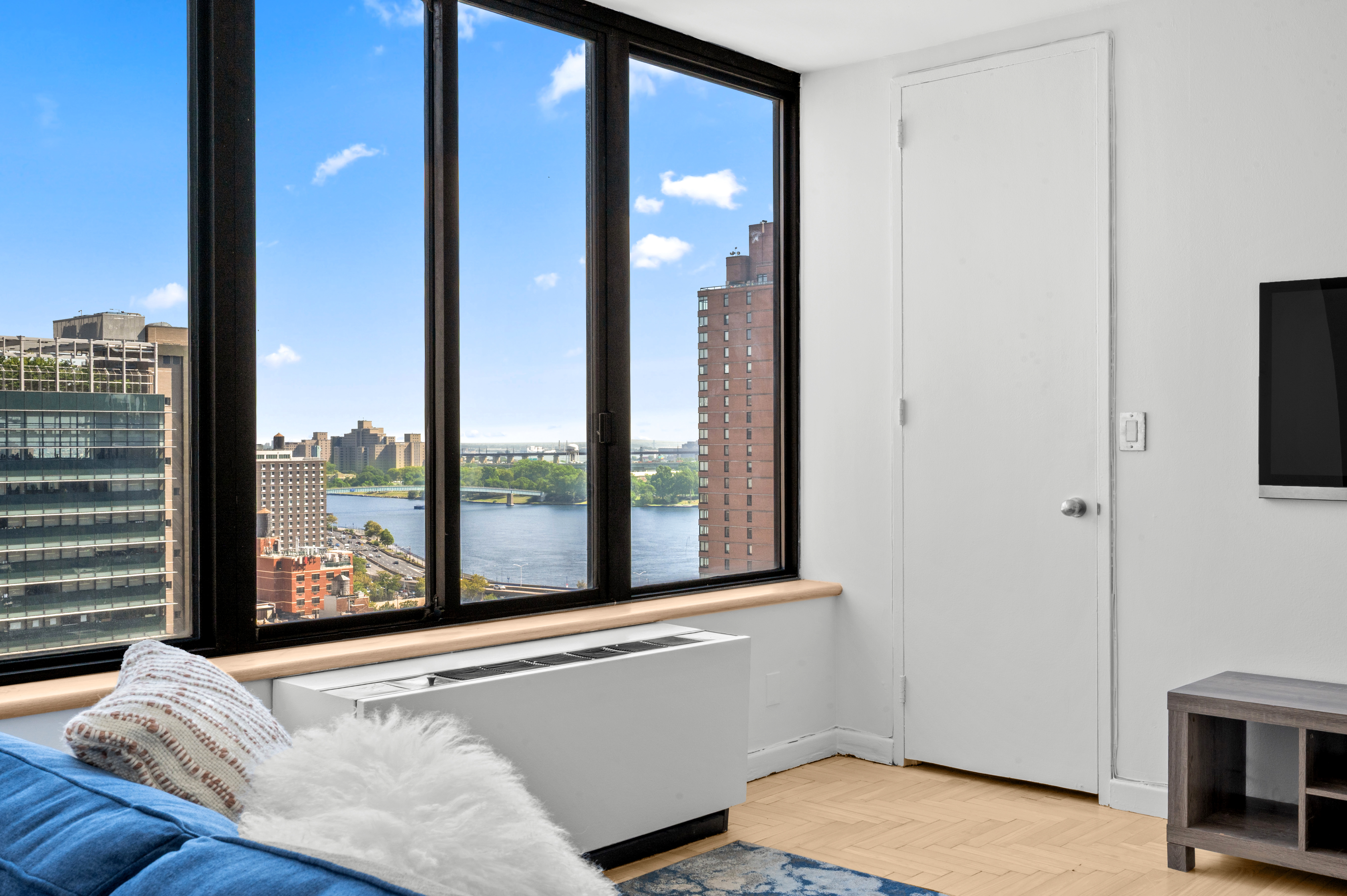 300 East 93rd Street, Unit 21C Manhattan, NY 10128 - Photo 2 of 6 a view of a living room and a balcony