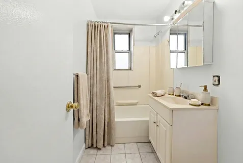 a bathroom with a sink a toilet and a tub