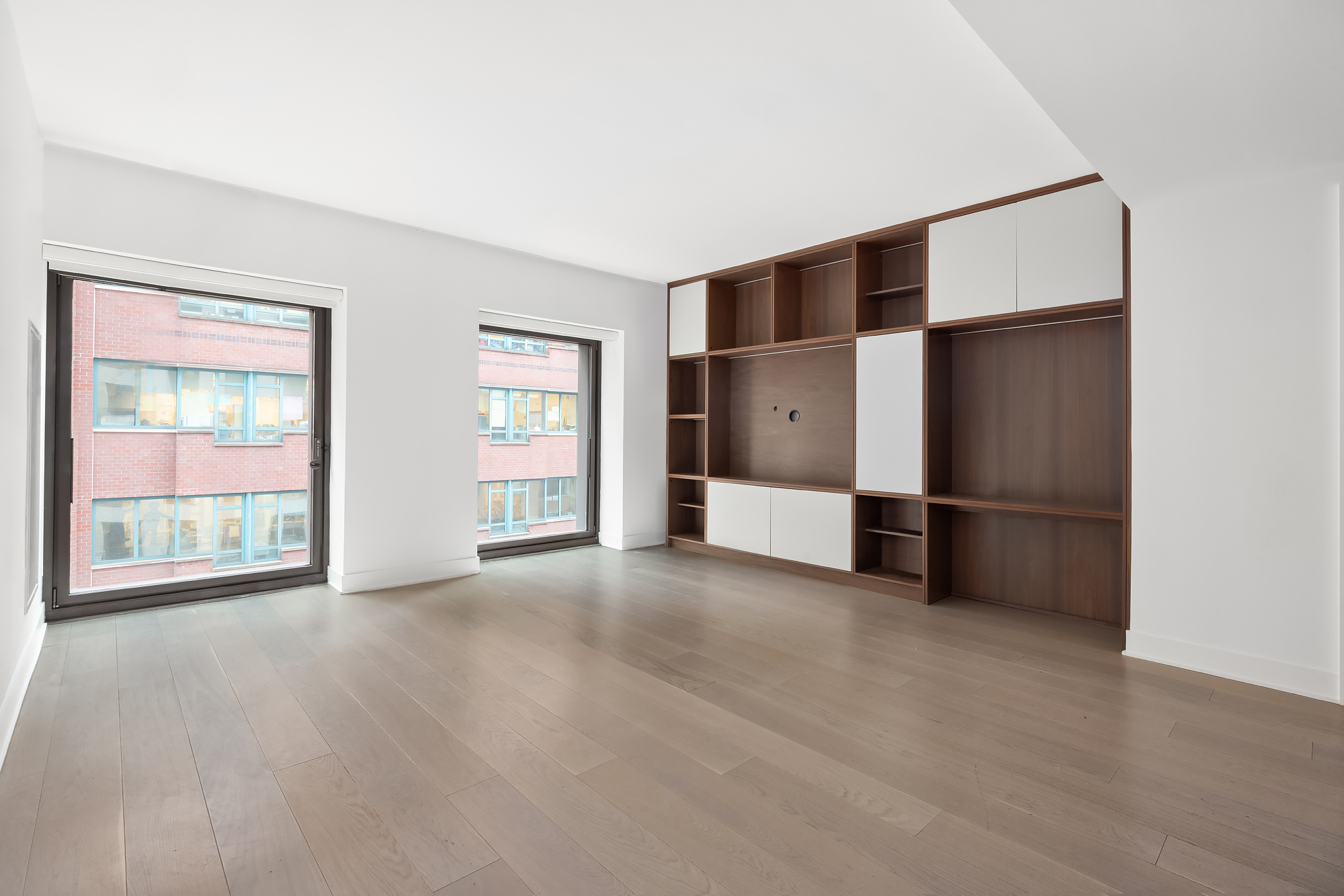 55 West 17th Street, Unit 603 Manhattan, NY 10011 - Photo 1 of 9 a view of an empty room with a window