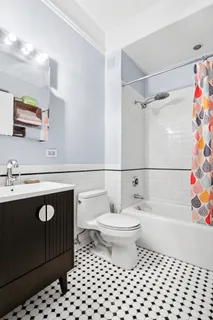 a bathroom with a sink a toilet and a bathtub