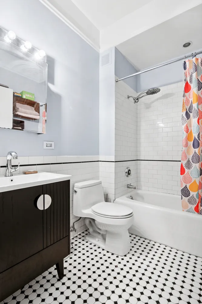 a bathroom with a sink a toilet and a bathtub