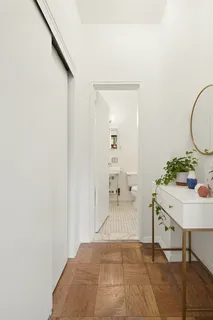 a bedroom with a bed and a table in it