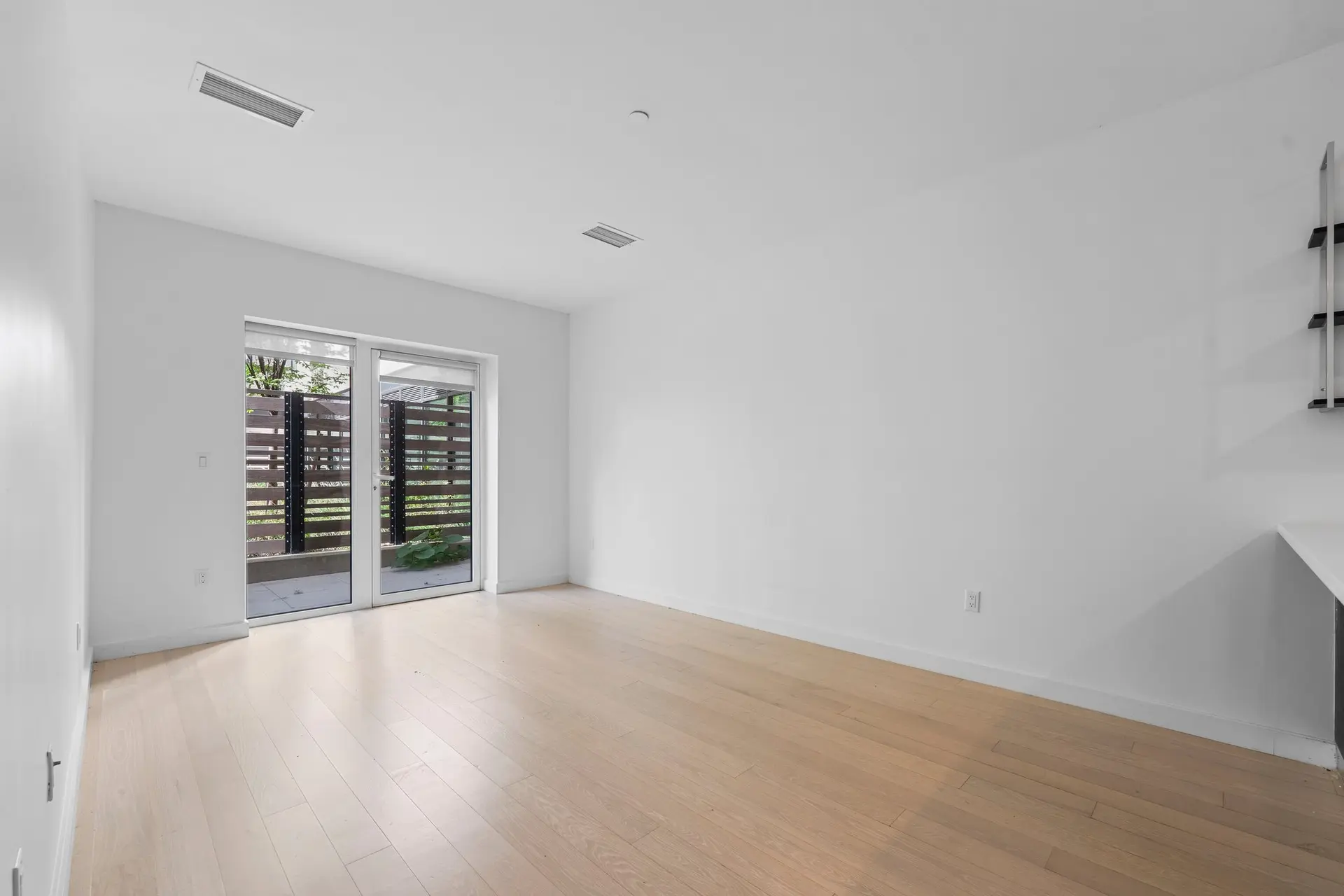 350 Clarkson Avenue, Unit 103 Brooklyn, NY 11226 - Photo 9 of 42 wooden floor in an empty room