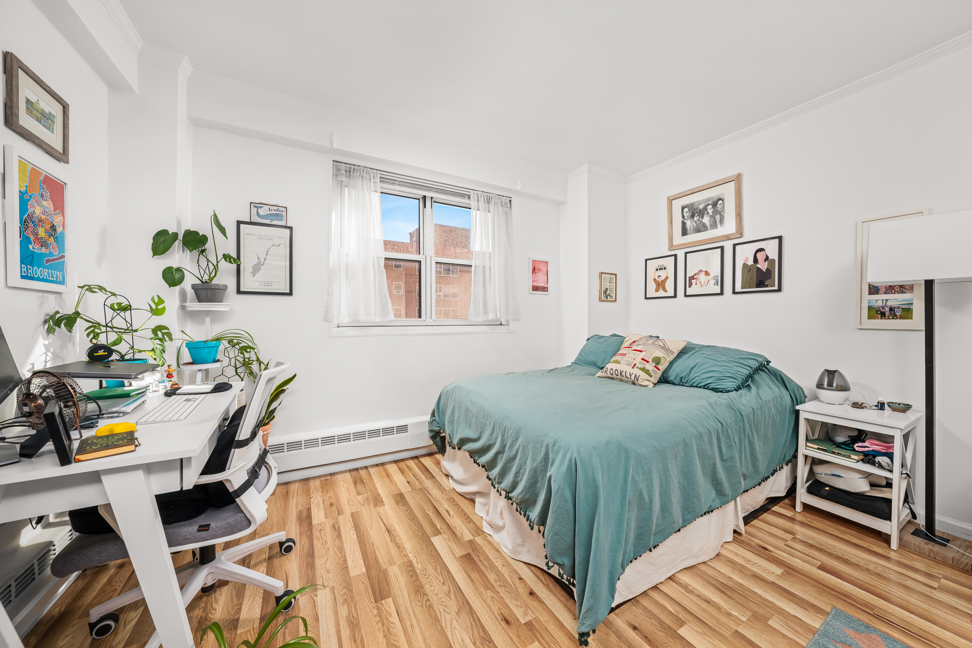 122 Ashland Place, Unit 14F Brooklyn, NY 11201 - Photo 5 of 16 a bedroom with a bed and a wooden floor