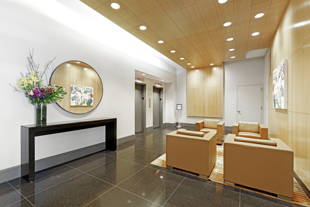 251 East 51st Street, Unit 5A Manhattan, NY 10022 - Photo 18 of 23 a lobby with furniture and a potted plant