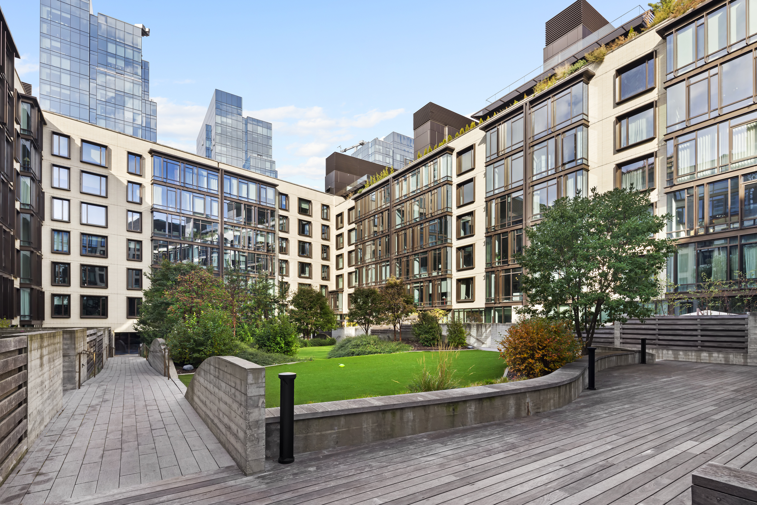 429 Kent Avenue, Unit TH2 Brooklyn, NY 11249 - Photo 29 of 34 a view of a building with garden