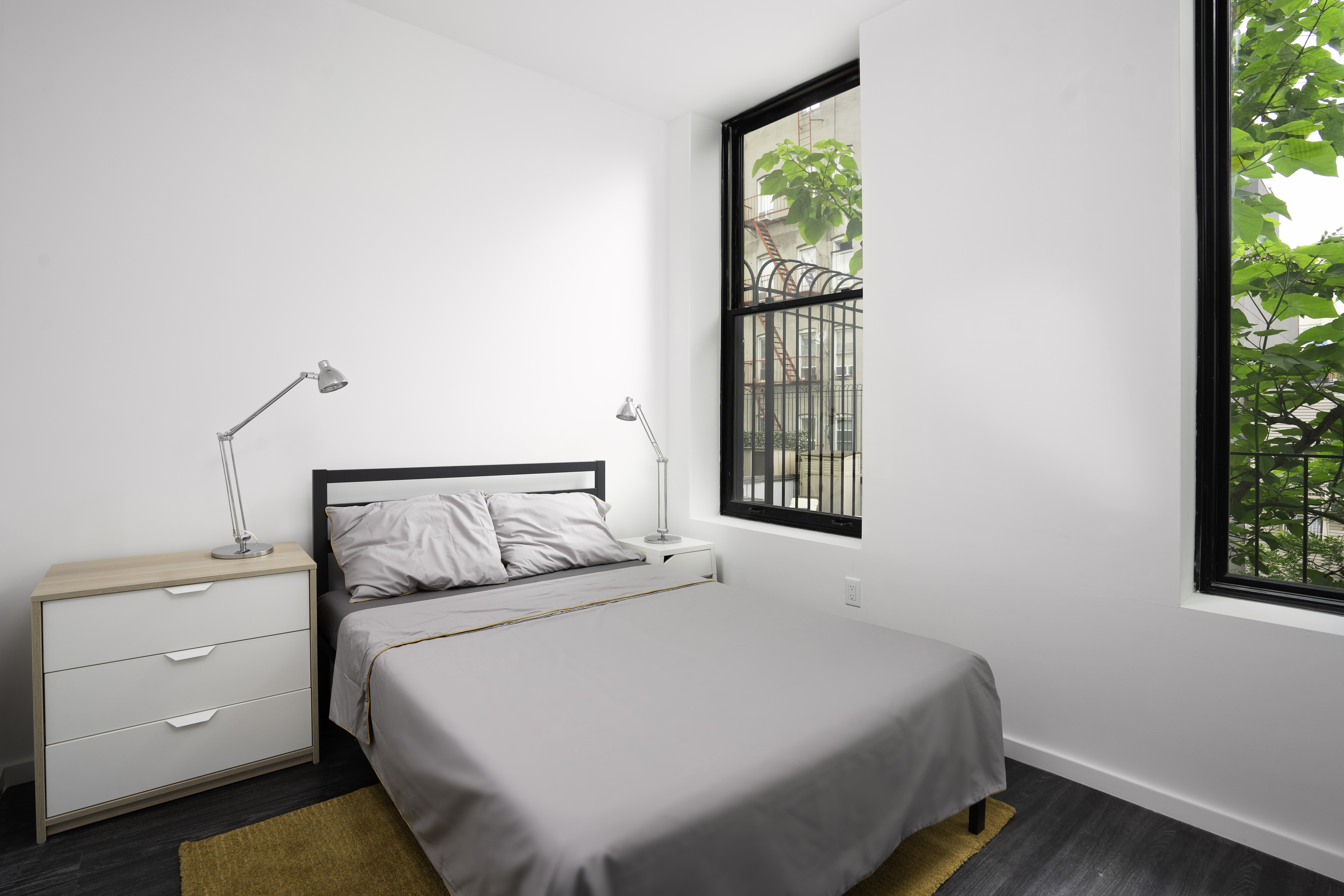 415 Broadway, Unit 3A Brooklyn, NY 11211 - Photo 4 of 8 a bedroom with a bed and a window