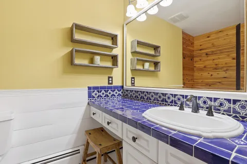 a bathroom with a bathtub and shower