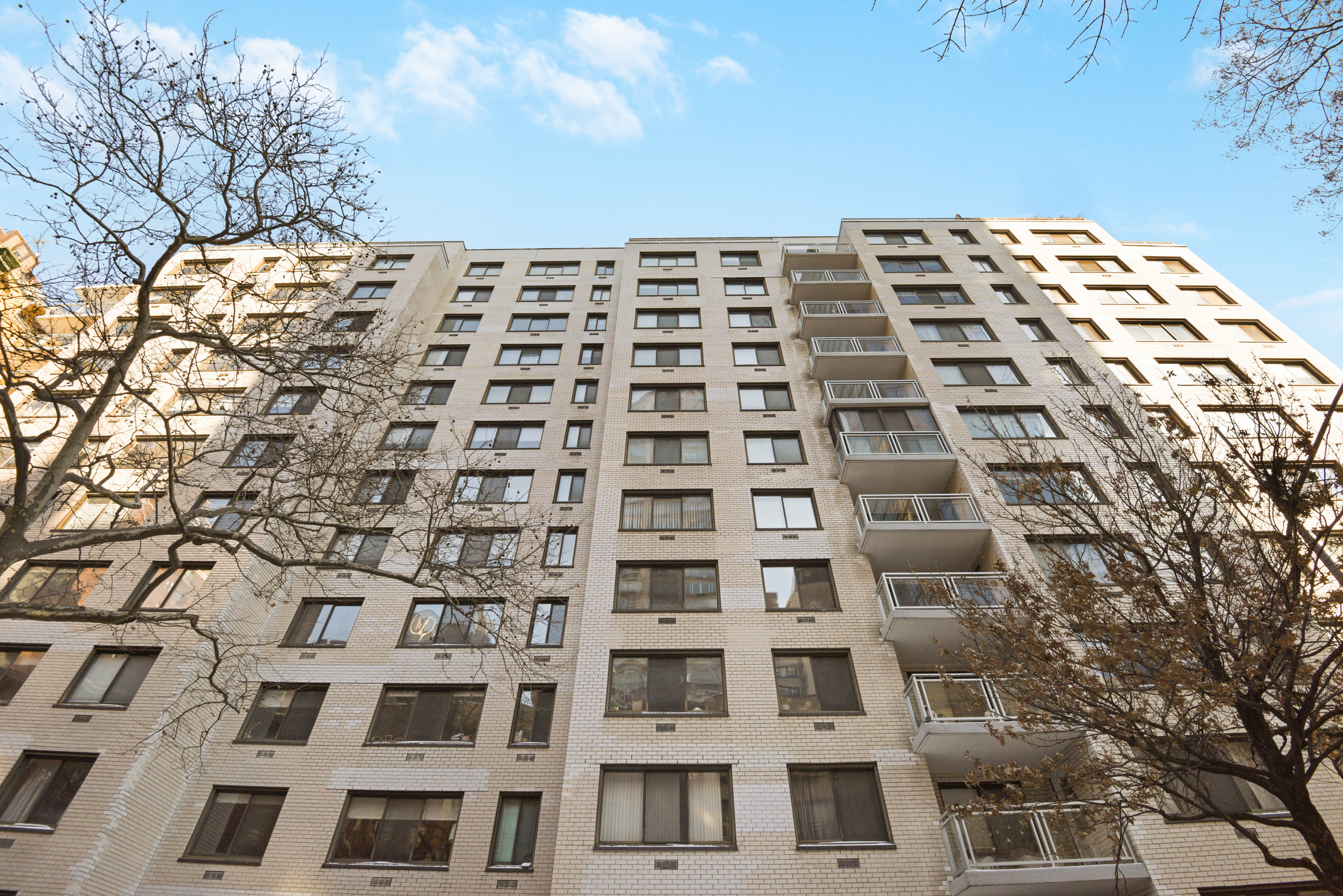 345 East 73rd Street, Unit 7J Manhattan, NY 10021 - Photo 12 of 13 a front view of a multi story building