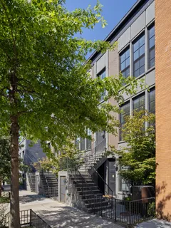a front view of a house with trees