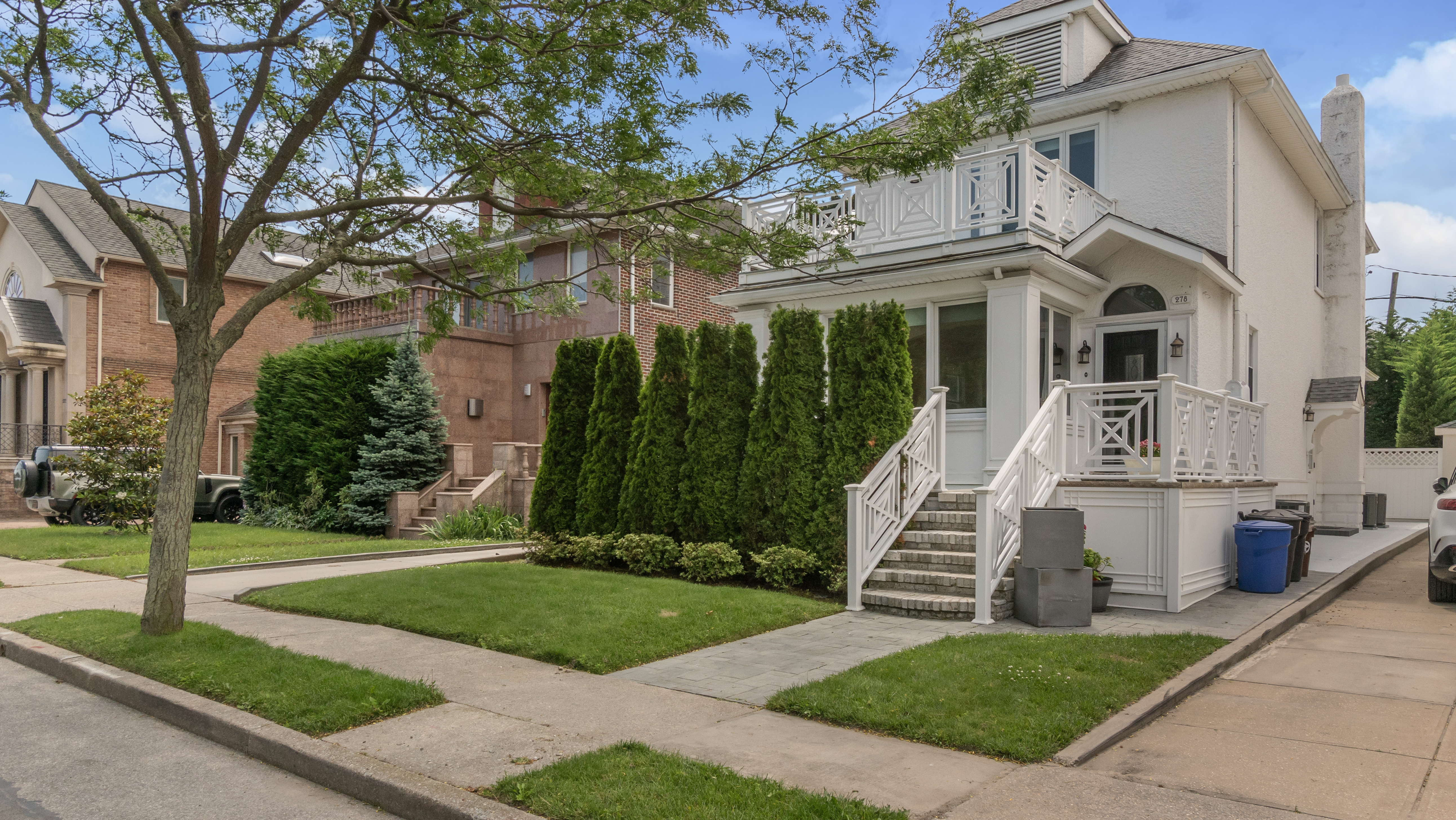 278 Amherst Street Brooklyn, NY 11235 - Photo 23 of 24 a front view of a house with a yard