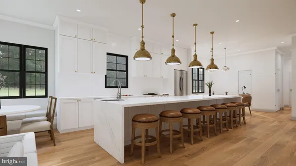 a view of a kitchen area with furniture and wooden floor