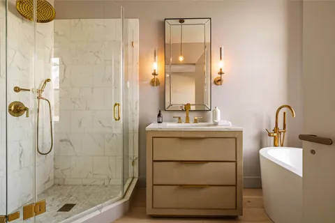 a bathroom with a sink toilet and shower