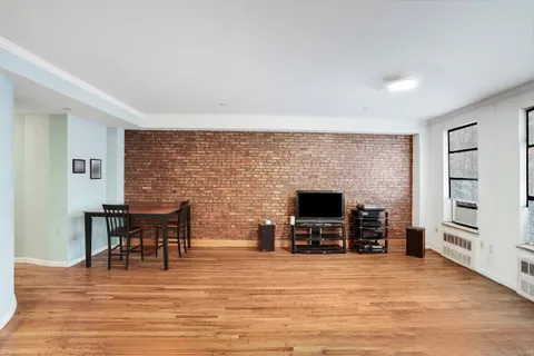 a view of a livingroom with furniture and a fireplace