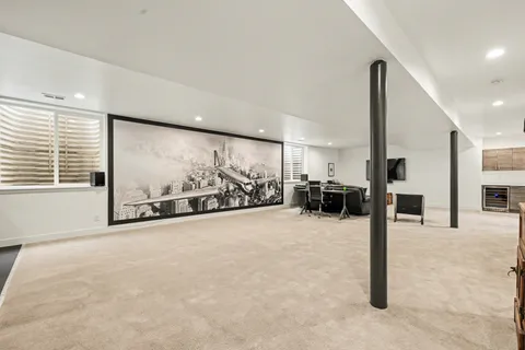 a view of a room with gym equipment and a large window