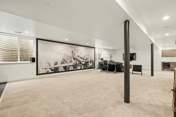 a view of a room with gym equipment and a large window