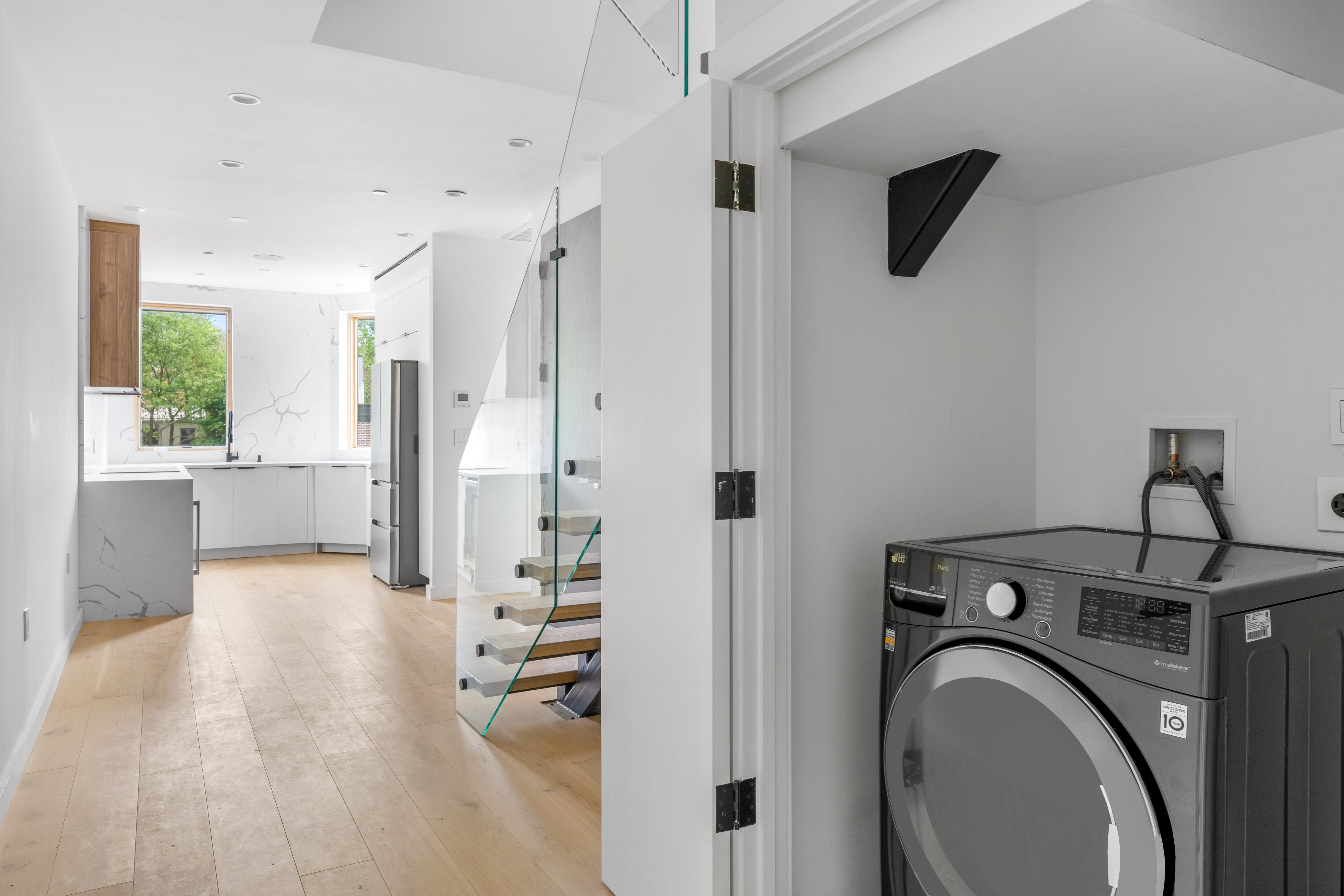 545 Lexington Avenue, Unit 2 Brooklyn, NY 11221 - Photo 5 of 23 a view of a hallway with washer and dryer